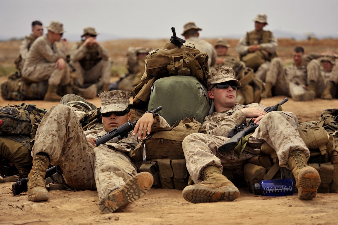 U.S. Marines assigned to the 13th Marine Expeditionary Unit take a nap on the beach after an exercise near Camp Lemonier, Djibouti, April 1, 2009. 