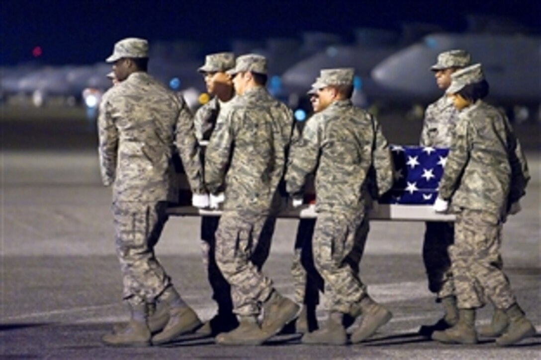 Servicemembers transfer the remains of U.S. Air Force Staff Sgt. Phillip A. Myers, of Hopewell, Va., at Dover Air Force Base, Del., April 5, 2009. Myers died April 4 near Helmand province, Afghanistan from wounds suffered from an improvised explosive device. He was assigned to the 48th Civil Engineer Squadron, Royal Air Force Lakenheath, United Kingdom. This was one of the first dignified transfers photographed under the new Department of Defense policy.