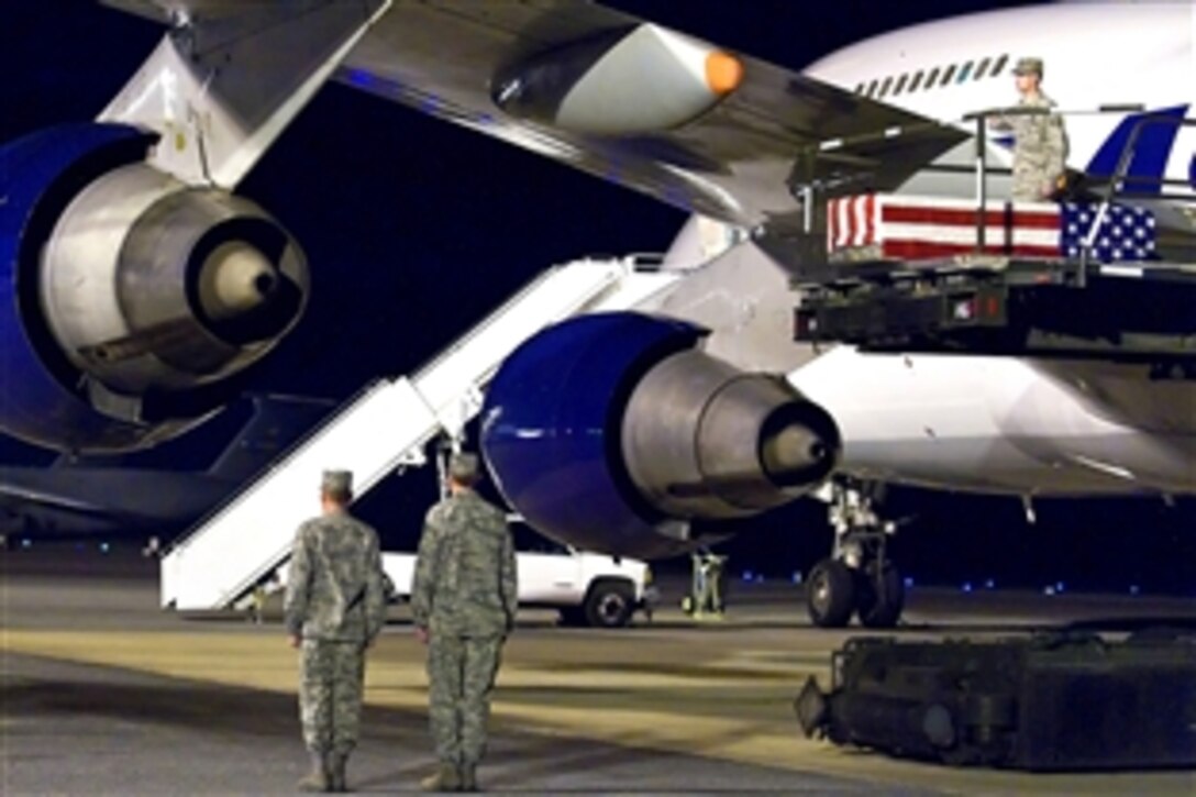U.S. Air Force airmen transfer the remains of Air Force Staff Sgt. Phillip A. Myers on Dover Air Force Base, Del., April 5, 2009. This was the first time the Defense Department has allowed families to permit media coverage of dignified transfer operations under a new policy. Myers, of Hopewell, Va., died April 4, 2009, from wounds suffered from an improvised explosive device near Helmand province, Afghanistan. He was assigned to the 48th Civil Engineer Squadron, Royal Air Force Lakenheath, Unite