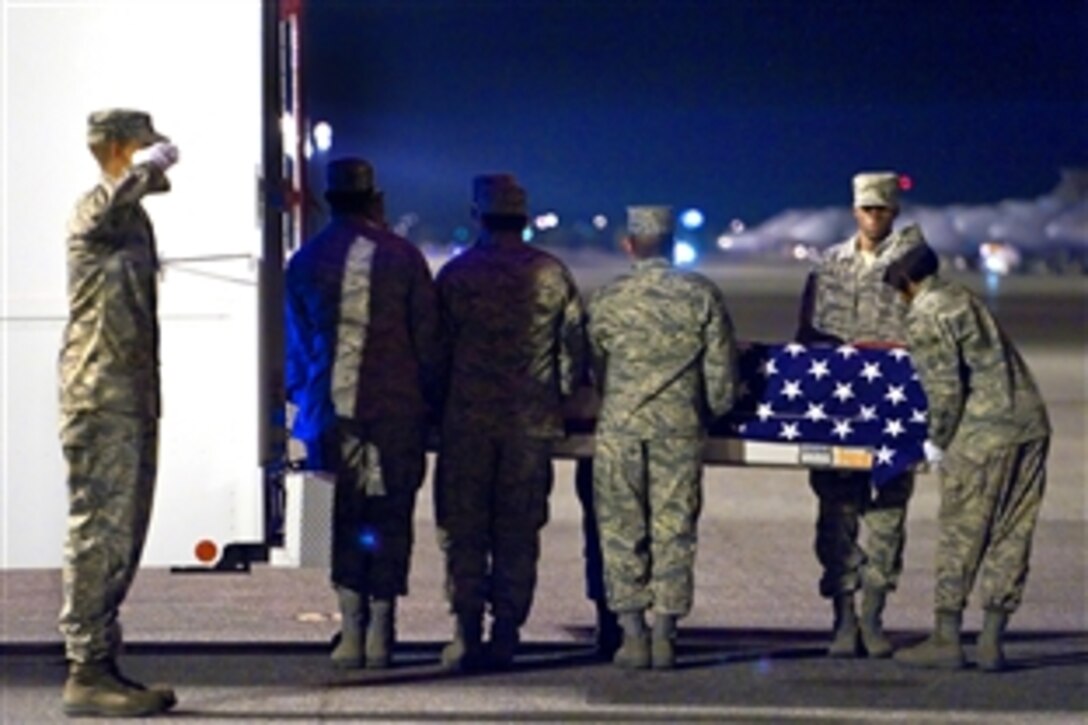 U.S. Air Force airmen transfer the remains of Air Force Staff Sgt. Phillip A. Myers on Dover Air Force Base, Del., April 5, 2009. This was the first time the Defense Department has allowed families to permit media coverage of dignified transfer operations under a new policy.