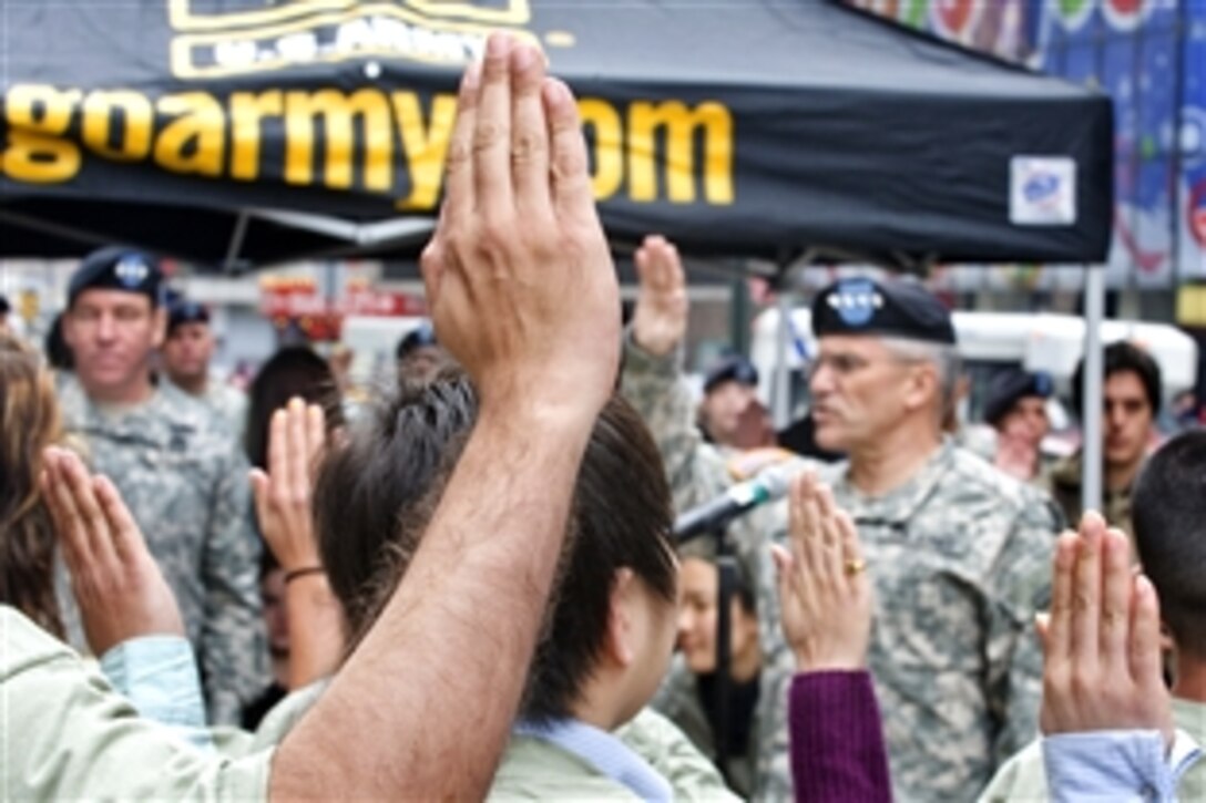 Army Gen. George W. Casey, Jr., the Army's chief of staff, administers the oath of enlistment to 26 recruits in New York City, April 1, 2009. The group included 16 recruits who are part of the Military Accessions Vital to the National Interest program, which allows non-resident aliens with special skills who are legally in the US to enlist in the Army.  