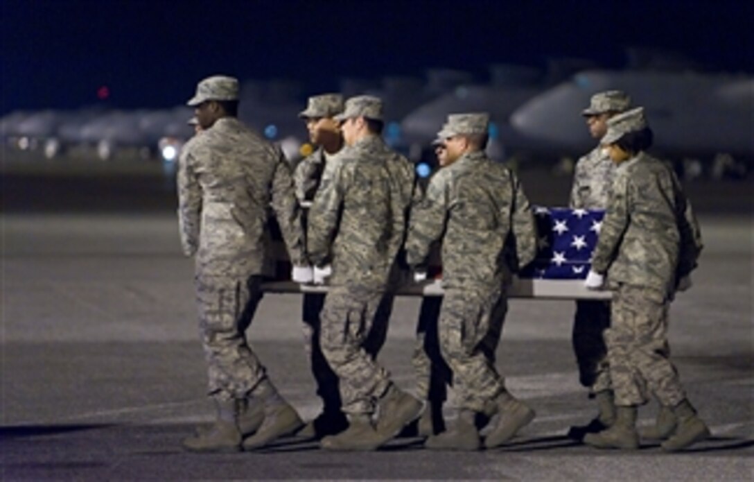 U.S. Air Force airmen transfer the remains of Air Force Staff Sgt. Phillip A. Myers during an arrival ceremony at Dover Air Force Base, Del., on April 5, 2009.  Myers died April 4, 2009, near the Helmand province of Afghanistan.  