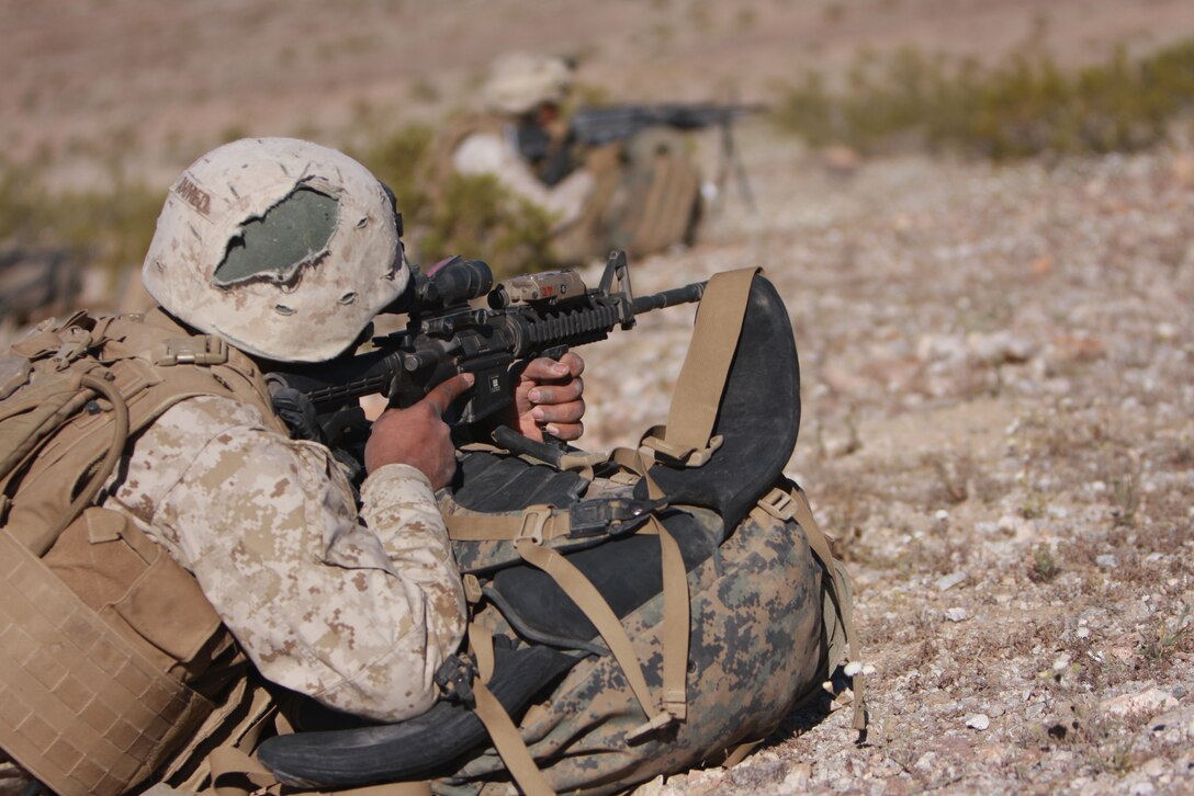 Seaman Sskief Ahmed, a corpsman with Company L, 3rd Battalion, 4th Marine Regiment, provides security for fellow service members during a patrol April 7 at the Combat Center’s Noble Pass.