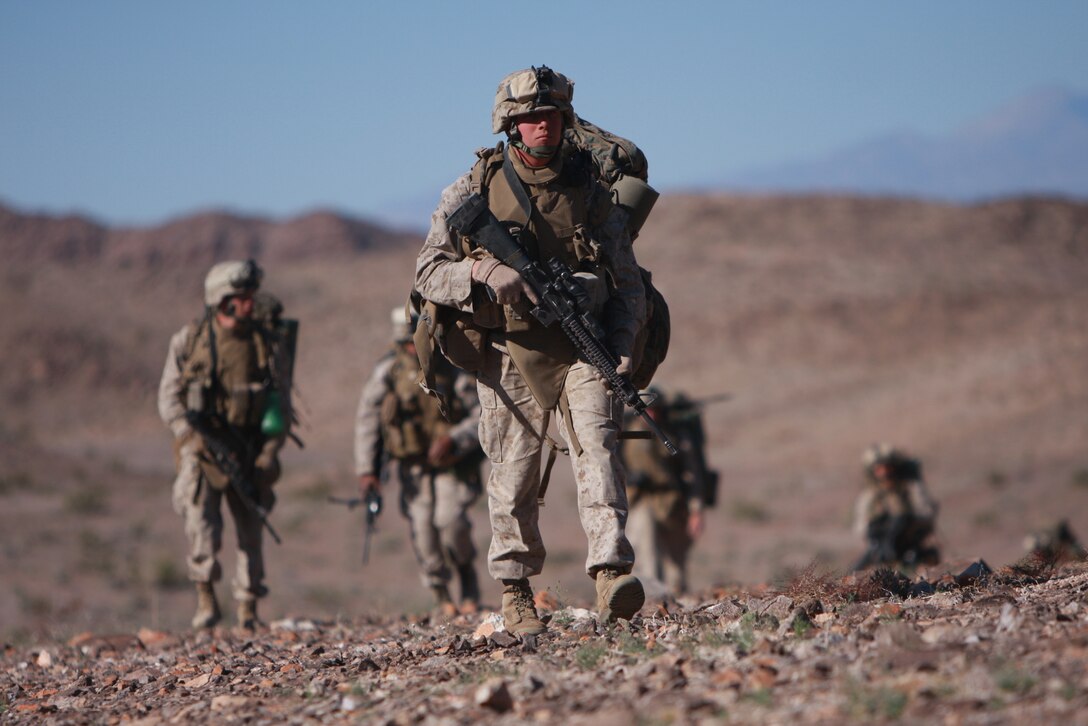 Marines and sailors with Company L, 3rd Battalion, 4th Marine Regiment, conduct a patrol early April 7 at the Combat Center’s Noble Pass as part of their week-long preparation for their Mojave Viper pre-deployment exercise.