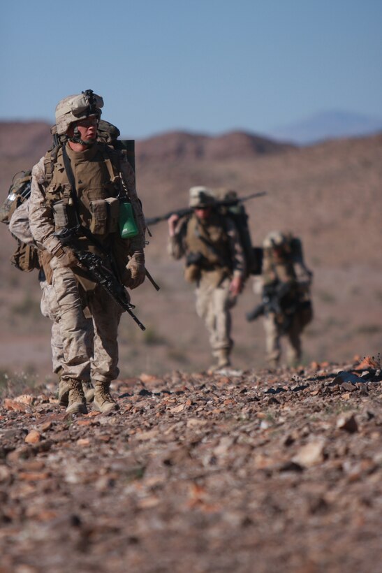 Marines and sailors with Company L, 3rd Battalion, 4th Marine Regiment, conduct a patrol early April 7 at the Combat Center’s Noble Pass as part of their week-long preparation for their Mojave Viper pre-deployment exercise.