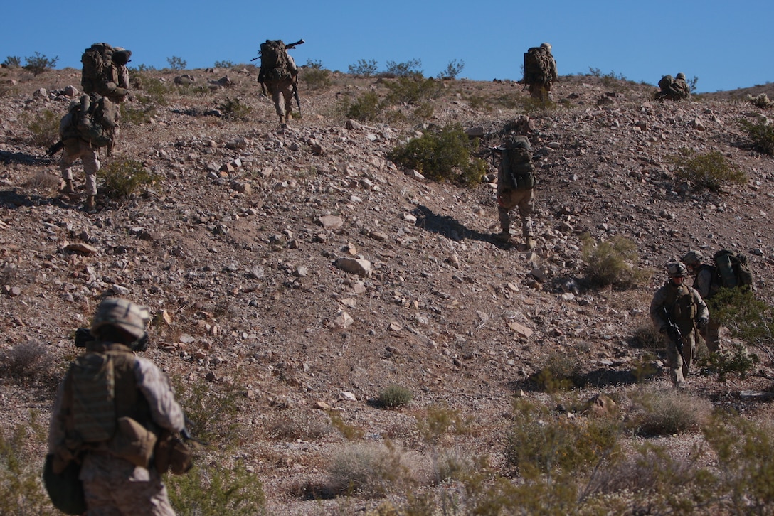 Marines and sailors with Company L, 3rd Battalion, 4th Marine Regiment, conduct a patrol early April 7 at the Combat Center’s Noble Pass as part of their week-long preparation for their Mojave Viper pre-deployment exercise.