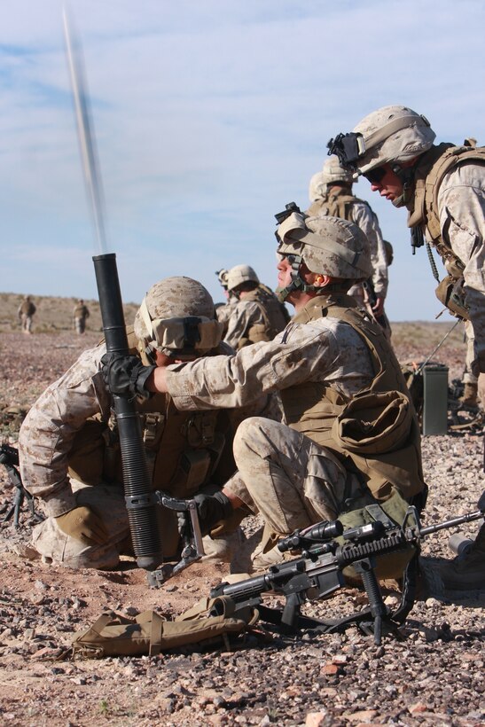A 60mm mortar round flies from the tube as Pfc. Adam Freidman, a mortar man with Company I, 3rd Battalion, 4th Marine Regiment fires for effect at the Combat Center’s Noble Pass April 7. The week-long training exercise was part of the battalion’s buildup to their Mojave Viper pre-deployment training exercise.