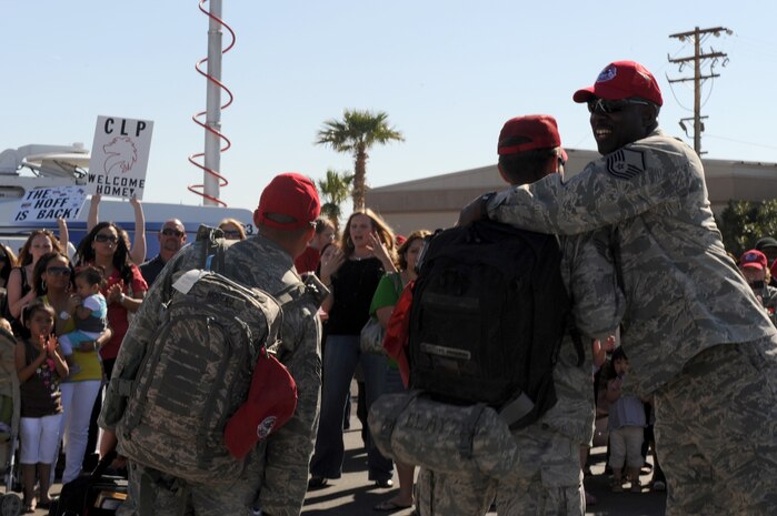 Airmen form the 820th RED HORSE Squadron receive a much needed "Welcome Home" upon their their arrival after a seven-month deployment in Southwest Asia , April 6, Nellis Air Force Base, Nev.The mission of the 820th RHS is to provide the Air Force with a highly -mobile civil engineering capability in support of contingency and special operations worldwide. 
(U.S. Air Force photo by Senior Airman Nadine Y. Barclay)  (RELEASED)