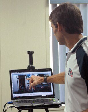 Bryan Hafler, a Human Performance and Rehabilitation Center fitness specialist and Iron Man, analyzes Staff Sgt. Angel Villalobos's gait in order to recommend treatment for shin splints at Hickam Air Force Base, Hawaii. The gait analysis is helpful for servicemembers who are experiencing pain, reoccuring sports injuries or who are interested in degreasing their run time. HPARC services are available to any TriCare beneficiaries, regardless of branch. (U.S. Air Force photo/Senior Airman Carolyn Viss) 
