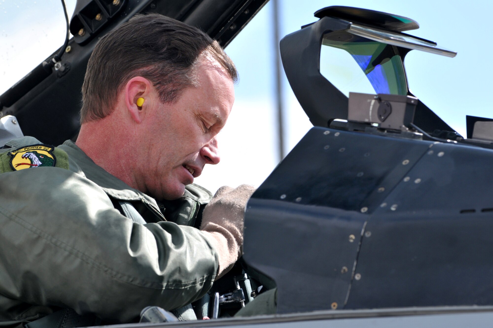 Col. Andrew R. "Hoops" Larson, Vice Commander of the 419th Fighter Wing, prepares to climb out of an F-16 cockpit. The colonel's final flight as part of the Air Force Reserve was Apr. 4, followed by his retirement ceremony the next day. (U.S. Air Force photo/Staff Sgt. Kyle Brasier)