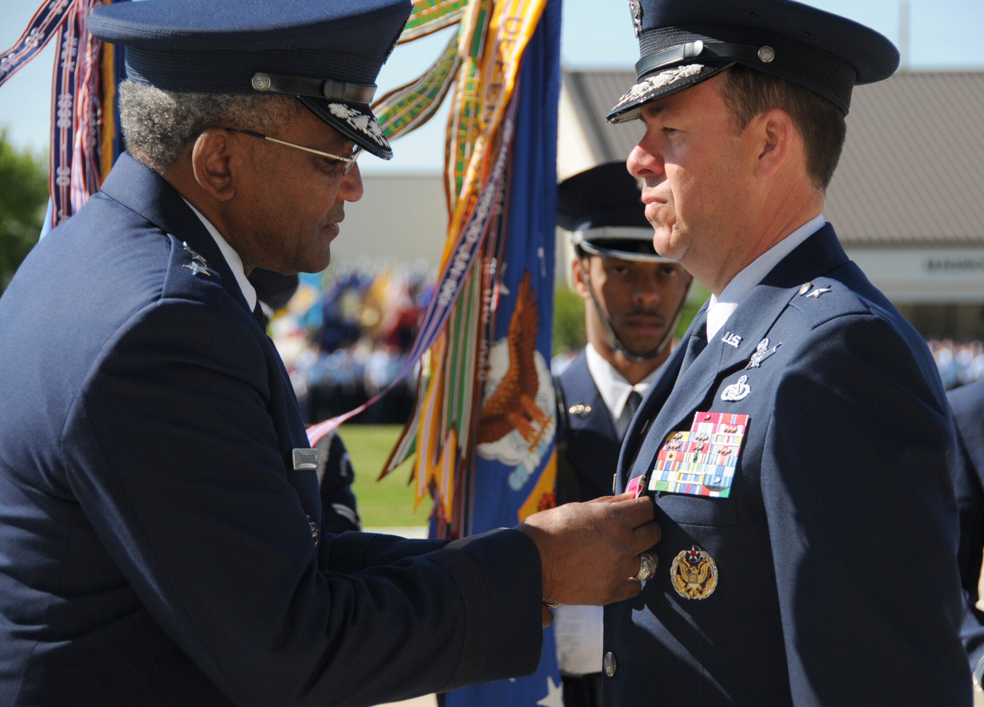 General Flowers presents the Legion of Merit to General Touhill.  (U.S. Air Force photo by Kemberly Groue)