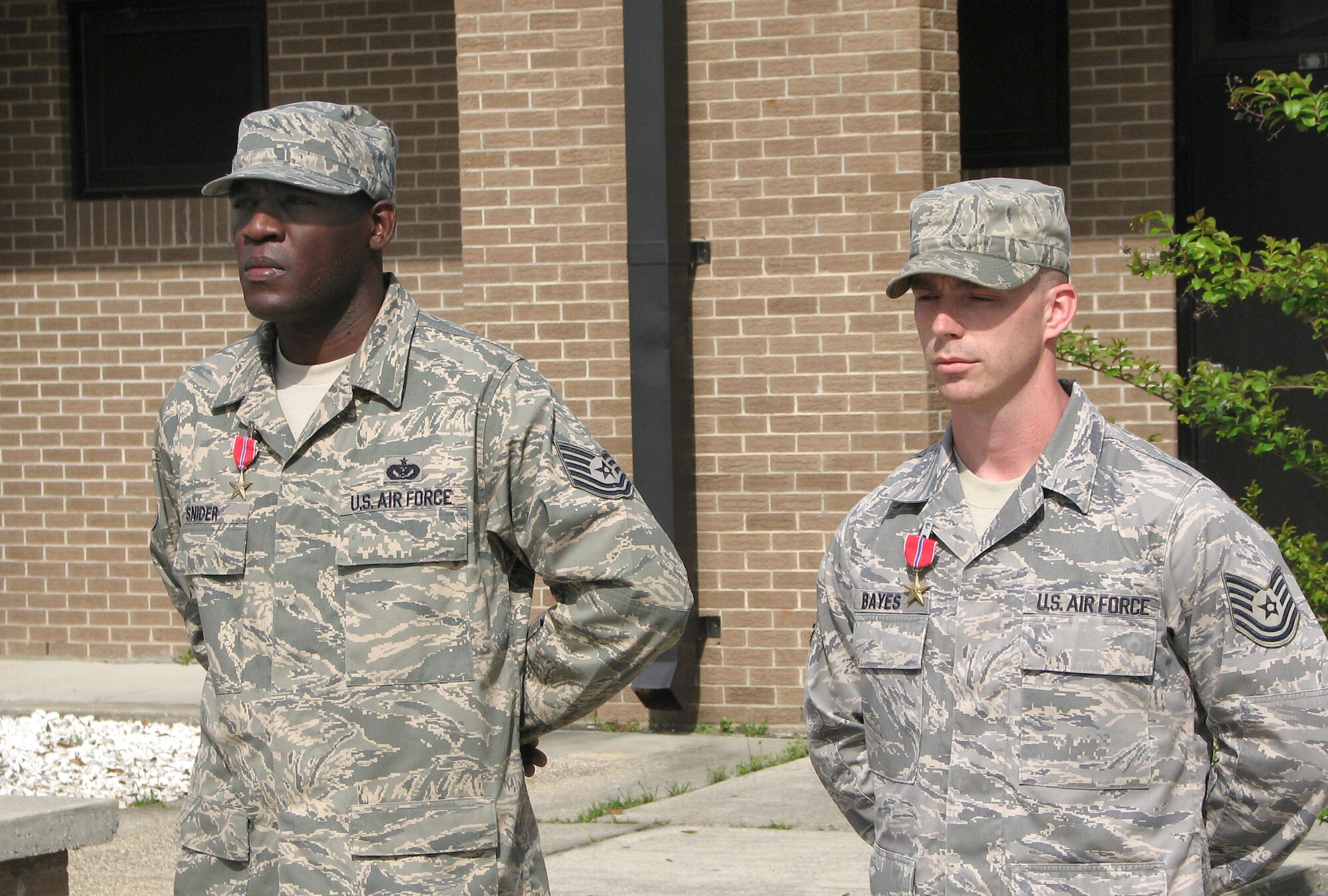 Sergeant Snider, left, and Sergeant Bayes were awarded Bronze Stars March 30 during a ceremony at the Naval Construction Training Center in Gulfport.  The medals were presented by Col. Tony Pounds, 782nd Training Group commander, Sheppard Air Force Base, Texas, the home base of the 366th TRS.  (U.S. Air Force photo by Petty Officer 2nd Class Corey Self)

