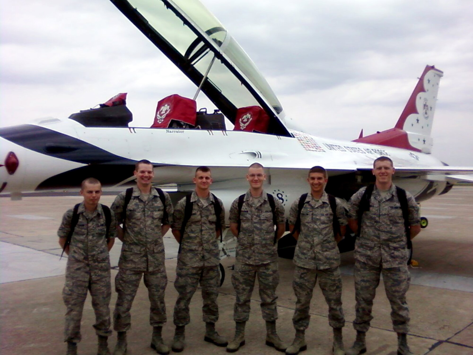 From left, Airman Basic Jeremy Vaughn, Airman 1st Class Ryan Woods, Airmen Basic Brian Gardner, Christopher McMahon and Joshua Perlow and Airman Sean Michaels got an up-close-and-personal view of Thunderbird No. 8.  (U.S. Air Force photo by Tech. Sgt. John Obermark)