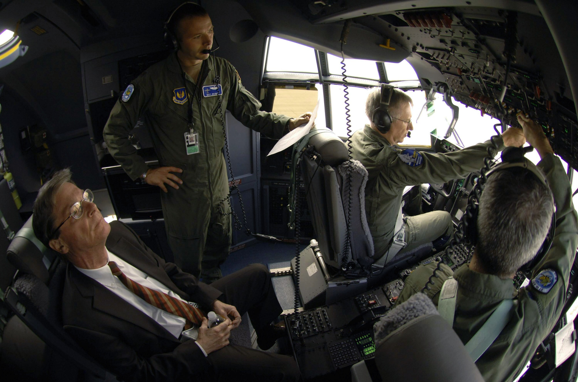 Prior to take-off from Spangdahlem Air Base, Germany, C-130J Super Hercules pilots Major Matt Wehner (standing) and Lt. Col. Craig Williams (right seat) assist Gen. Roger A. Brady, U.S. Air Forces in Europe commander, in pre-flighting a J-model Hercules on the last leg of its trans-Atlantic journey from the aircraft assembly plant in Marietta, Ga., to its new home at Ramstein AB, Germany. The pilots are assigned to the 37th Airlift Squadron at Ramstein. General Brady's host-nation advisor, Dick Motz, (left) had a front-row seat for the flight. (Defense Department photo/Master Sgt. Scott Wagers)
