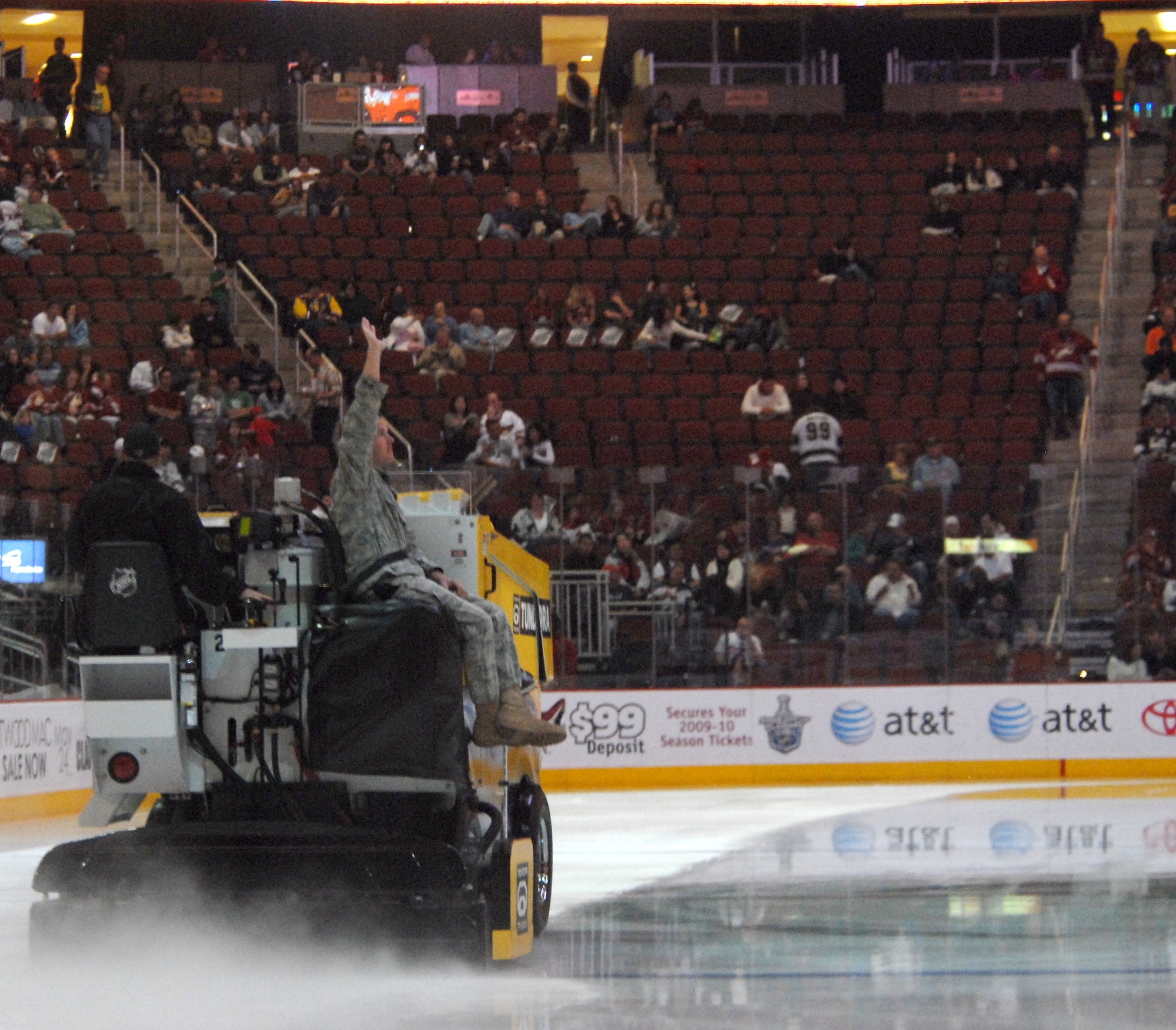 Senior Airman Anthony Wade, 944th Security Forces Squadron, rides a zamboni during the Coyotes hockey game April 2 at Jobing.com Arena in Glendale, Ariz. The Phoenix Coyotes took on the Los Angeles Kings during Armed Forces Night. Twice a year, the Phoenix Coyotes and the City of Glendale recognizes military members throughout the Valley for their military service.  Airman Wade, a security forces member with the 944th Fighter Wing, returned in January from  a six-month deployment to Kirkuk Regional Air Base, Iraq. While there, Senior Airman Wade responded without hesitation to two separate rocket attacks and helped limit the casualties to U.S. personnel and minimized any further threat. For his actions, he was named the Airman of the Quarter for the 506th Security Forces Squadron at Kirkuk.(U.S. Air Force photo by Airman 1st Class Ronifel Yasay)