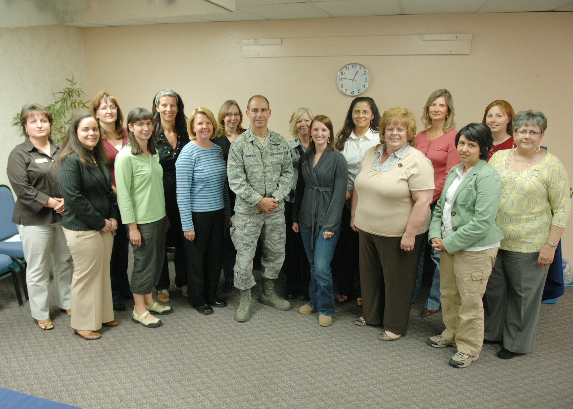 Col. Jeff Harrigian, 49th Fighter Wing commander, pose for a picture with attendees of the Heartlink seminar at the Airman Family Readiness Center at Holloman Air Force Base, N.M., April 3, 2009. Heartlink provides Holloman spouses a chance to learn about the Air Force and meet new people. (U.S. Air Force photo/SSgt Anthony Nelson Jr)