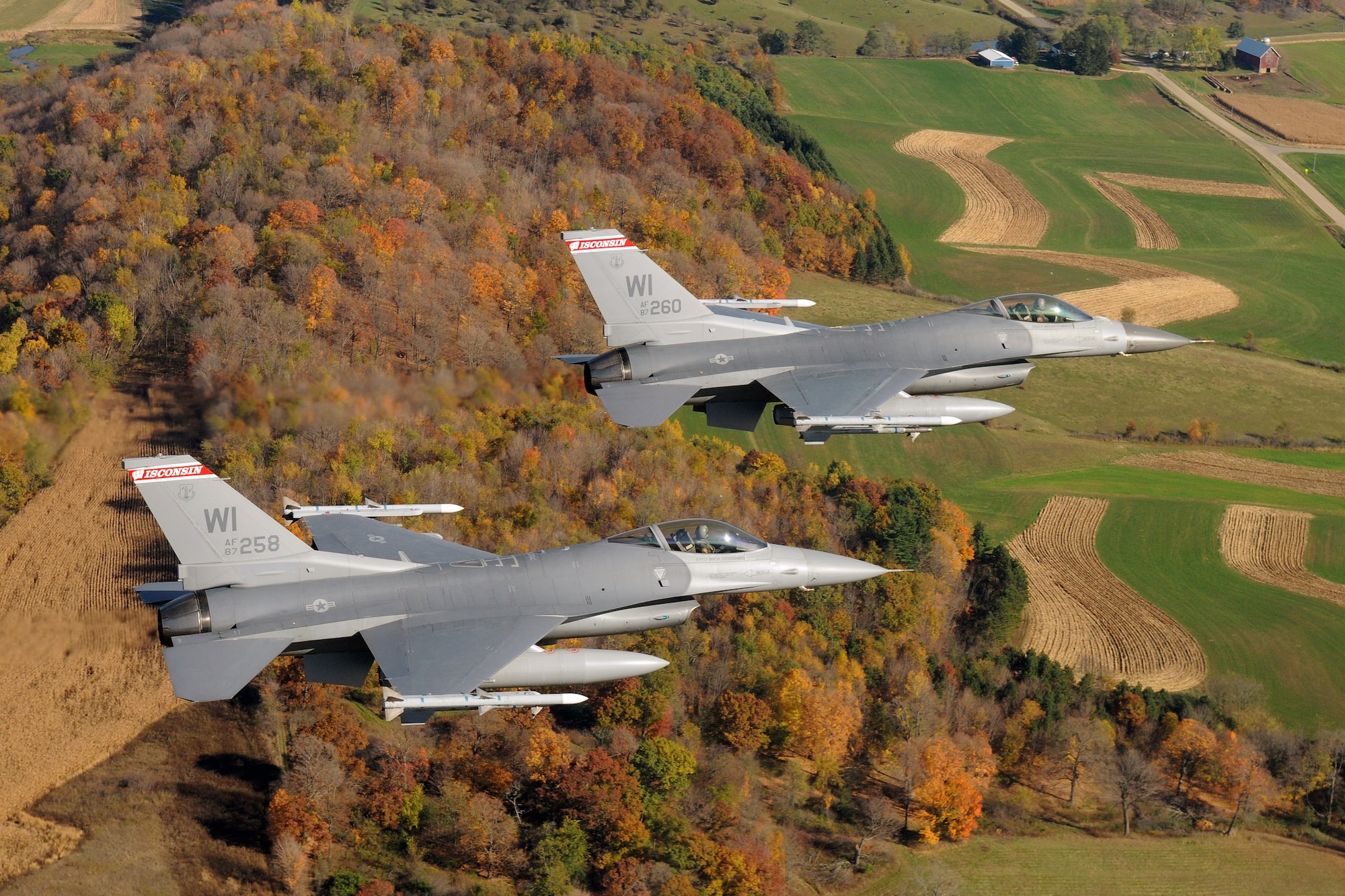 A two-ship formation of F-16 Fighting Falcons like these, shown on a routine training mission, intercepted a suspicious aircraft April 6 as it flew into U.S. airspace. The F-16s are from the Wisconsin Air National Guard's 115th Fighter Wing. (U.S. Air Force photo/Master Sgt. Paul Gorman) 
