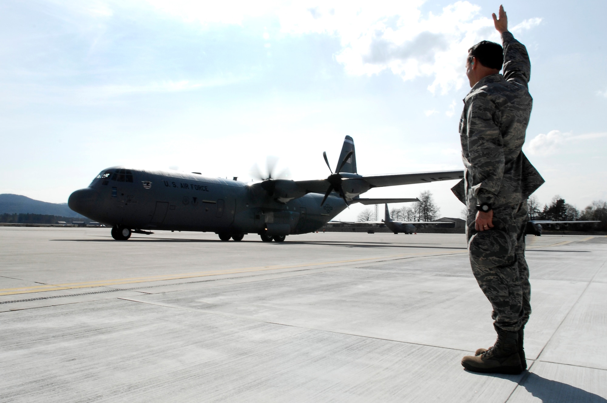 Col. Donald Bacon, 435th Air Base Wing commander, helps usher in U.S. Air Forces in Europe's first C-130J aircraft during a ceremony, April 7, 2009, Ramstein Air Base, Germany.  The aircraft's owning unit, the 86th Airlift Wing, celebrated not only the arrival of the J-model during the ceremony, but also a new era in operations for the 86th AW. (U.S. Air Force photo by Senior Airman Amber Bressler)
