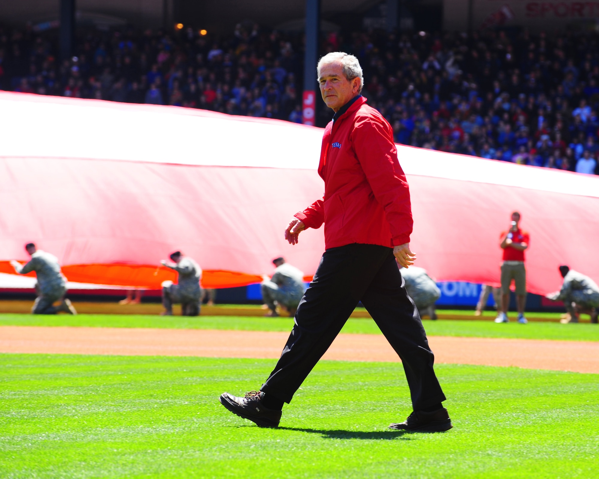 ARLINGTON, Texas - Former President George W. Bush is introduced to throw out the first pitch at opening day. The former president was among many honories at the celebration to kick off the regular seaason for the Texas Rangers. (U.S. Air Force phot by Staff Sgt Alan Garrison)