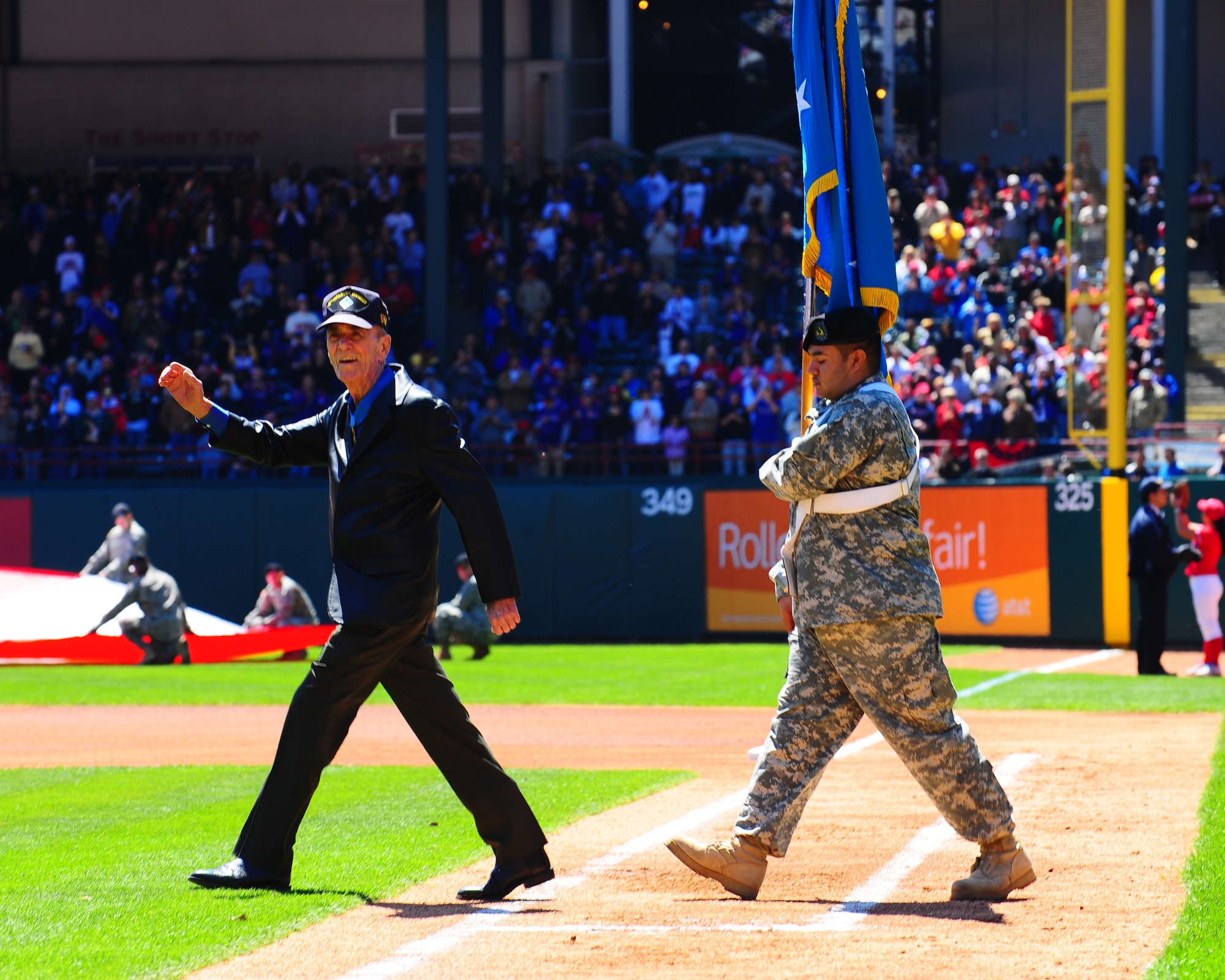 ARLINGTON, Texas - A Medal of Honor recipient from actions during Vietnam is introduced during the pregame opening day ceremony here Monday April 6.  He was one of many military honories during the festivities just before the game between the Texas Rangers and the Cleveland Indians.  (U.S. Air Force photo by Staff Sgt Alan Garrison)