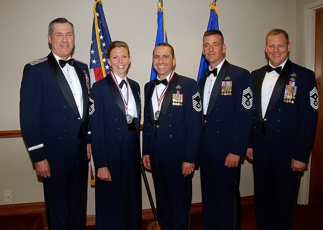 Senior Master Sgts. Tanya Yahn and Paul Raymond (second and third from left) are honored at the Chief Recognition Ceremony April 4 at the Sheppard Club. The senior master sergeants were among four Team Sheppard members selected for promotion to E-9 during the last board. Brig. Gen. O.G. Mannon (far left), 82nd Training Wing commander, and Chief Master Sgt. Kenneth Sallinger (far right), 82nd TRW command chief, attended the ceremony. Chief Master Sgt. Paul Moreau (second from right), 2nd Air Force command chief, was the guest speaker at the ceremony. Sergeant Yahn is the 82nd Medical Support Squadron superintendent. Sergeant Raymond is the 82nd Logistics Readiness Squadron superintendent, (U.S. Air Force photo/Harry Tonemah)