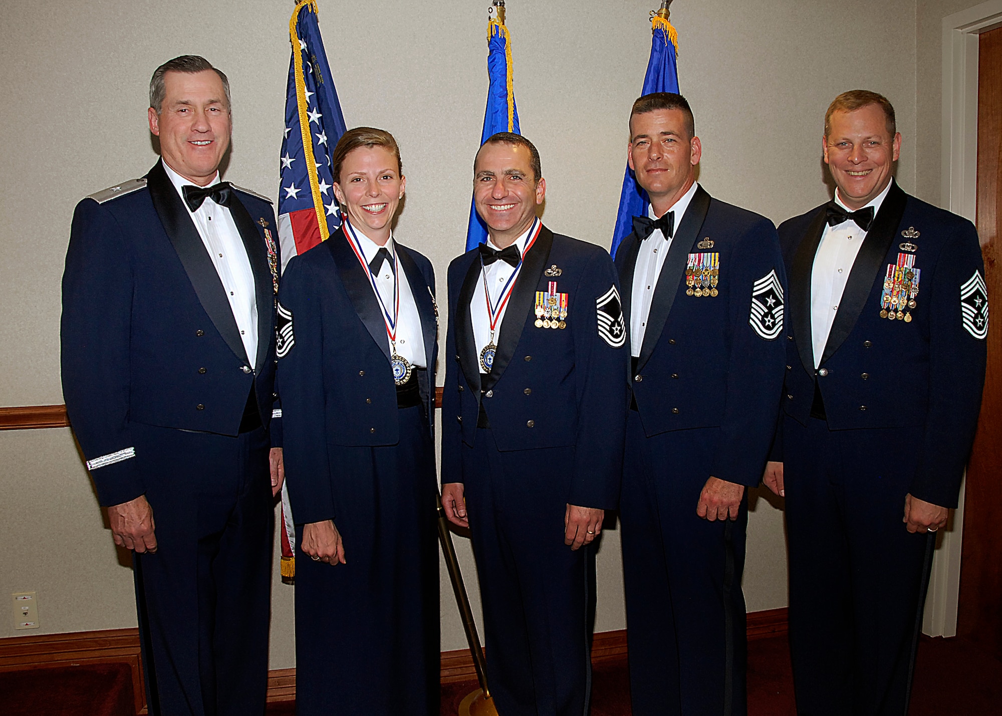 Senior Master Sgts. Tanya Yahn and Paul Raymond (second and third from left) are honored at the Chief Recognition Ceremony April 4 at the Sheppard Club. The senior master sergeants were among four Team Sheppard members selected for promotion to E-9 during the last board. Brig. Gen. O.G. Mannon (far left), 82nd Training Wing commander, and Chief Master Sgt. Kenneth Sallinger (far right), 82nd TRW command chief, attended the ceremony. Chief Master Sgt. Paul Moreau (second from right), 2nd Air Force command chief, was the guest speaker at the ceremony. Sergeant Yahn is the 82nd Medical Support Squadron superintendent. Sergeant Raymond is the 82nd Logistics Readiness Squadron superintendent, (U.S. Air Force photo/Harry Tonemah)