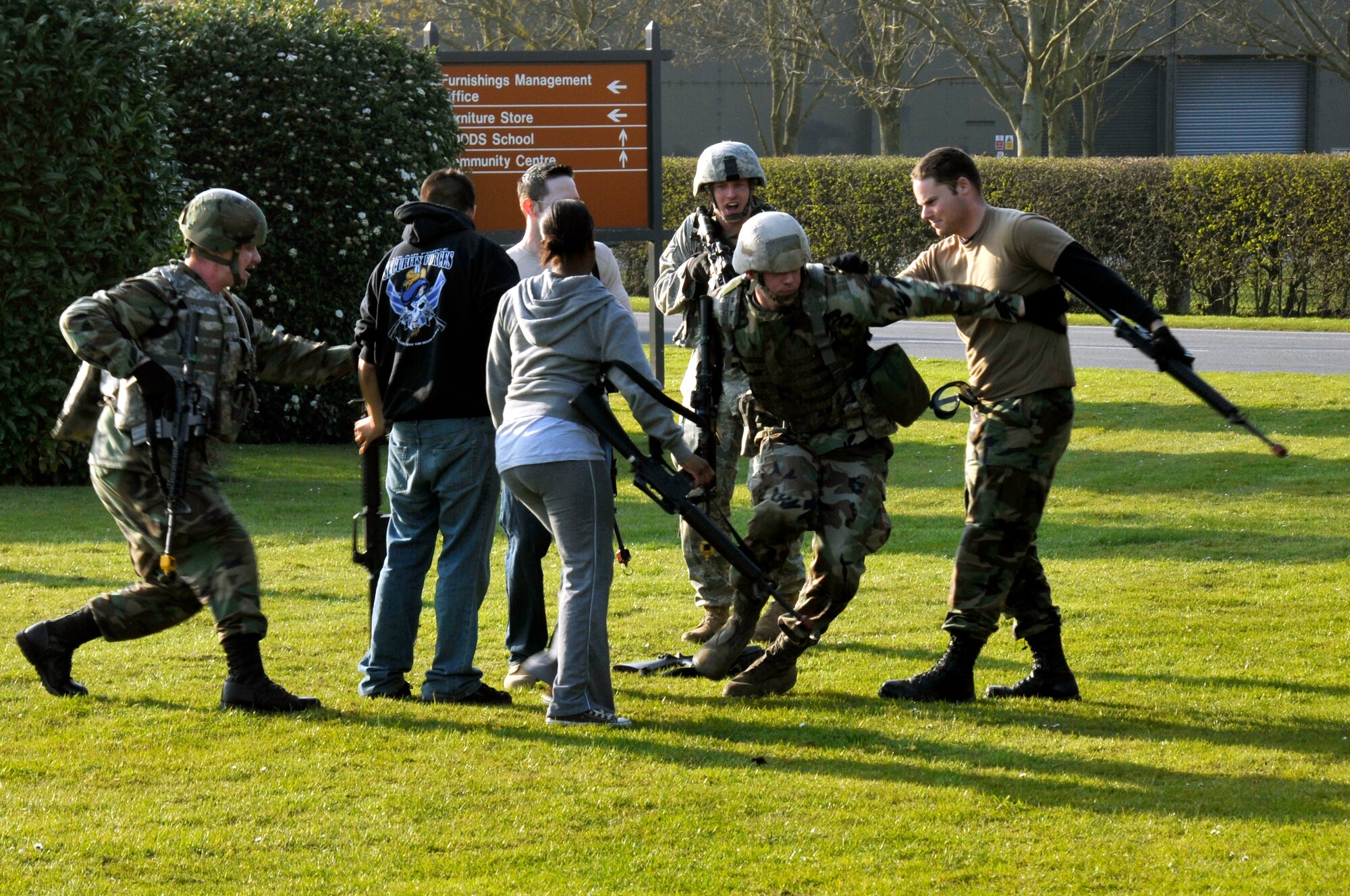 ROYAL AIR FORCE FELTWELL, England -- 48th Security Forces Squadron Airmen surprise the opposing force members and attempt to apprehend and disarm them here April 2, 2009. Airmen from the 48th SFS participated in an air base defense exercise. The training is an annual requirement for the squadron. (U.S. Air Force photo by Airman 1st Class Perry Aston) (Released)