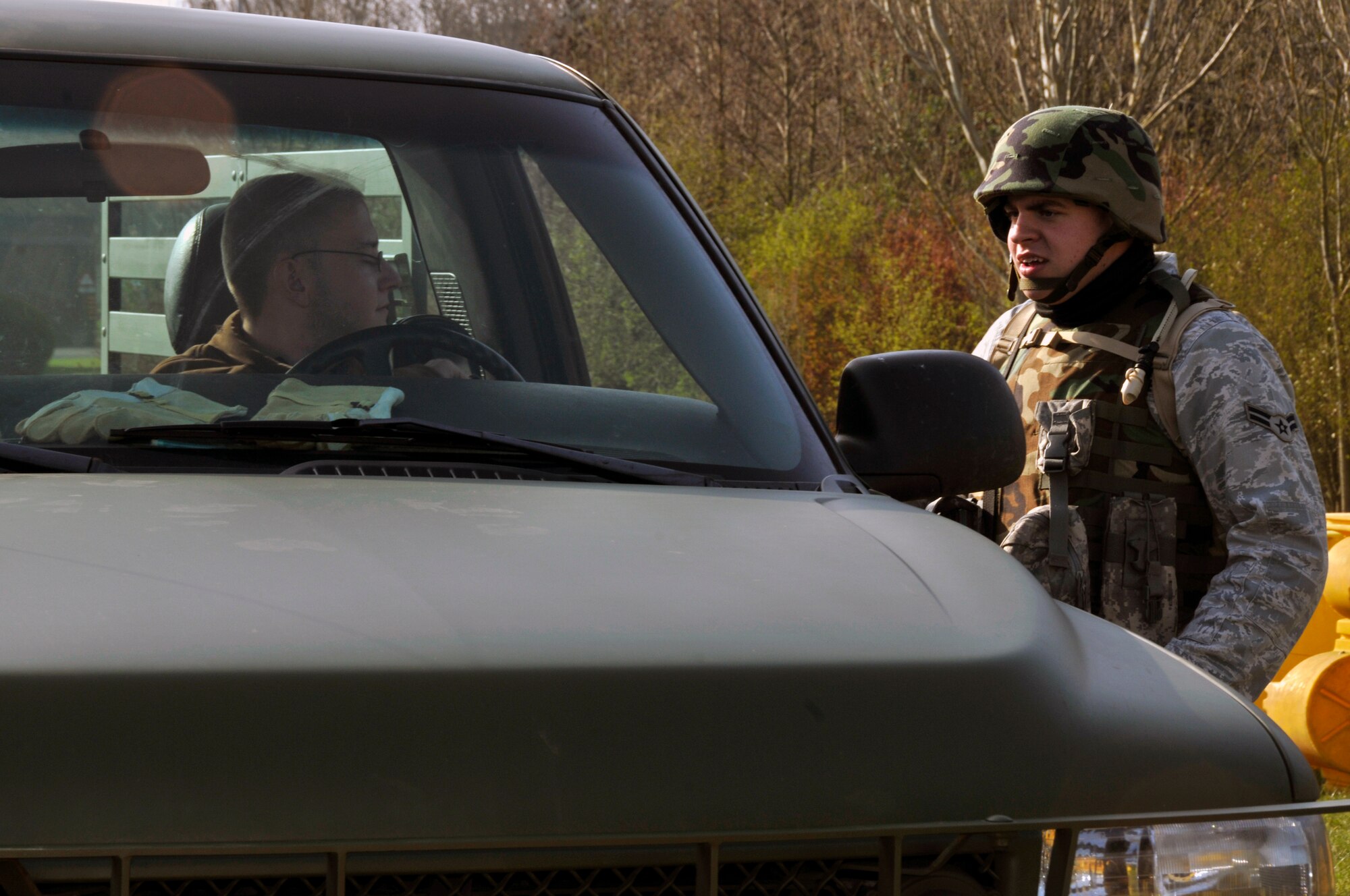 ROYAL AIR FORCE FELTWELL, England -- Airman 1st Class Derek Aldridge 48th Security Forces Squadron, instructs the driver to step out of the vehicle so it can be searched here April 2, 2009. Airmen from the 48th SFS participated in an air base defense exercise. The training is an annual requirement for the squadron. (U.S. Air Force photo by Airman 1st Class Perry Aston) (Released)