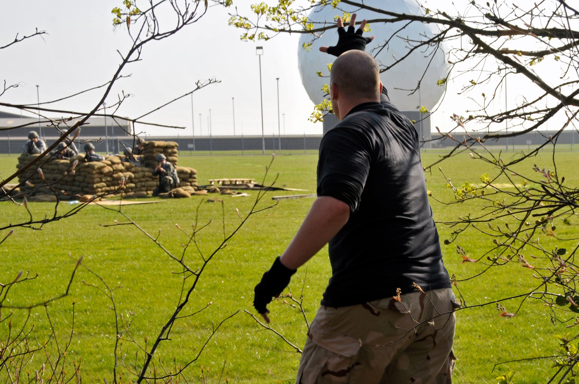 ROYAL AIR FORCE FELTWELL, England -- An opposing force member harasses 48th Security Forces Squadron Airmen to see how they will retaliate here April 2, 2009. Airmen from the 48th SFS participated in an air base defense exercise. The training is an annual requirement for the squadron. (U.S. Air Force photo by Airman 1st Class Perry Aston) (Released)
