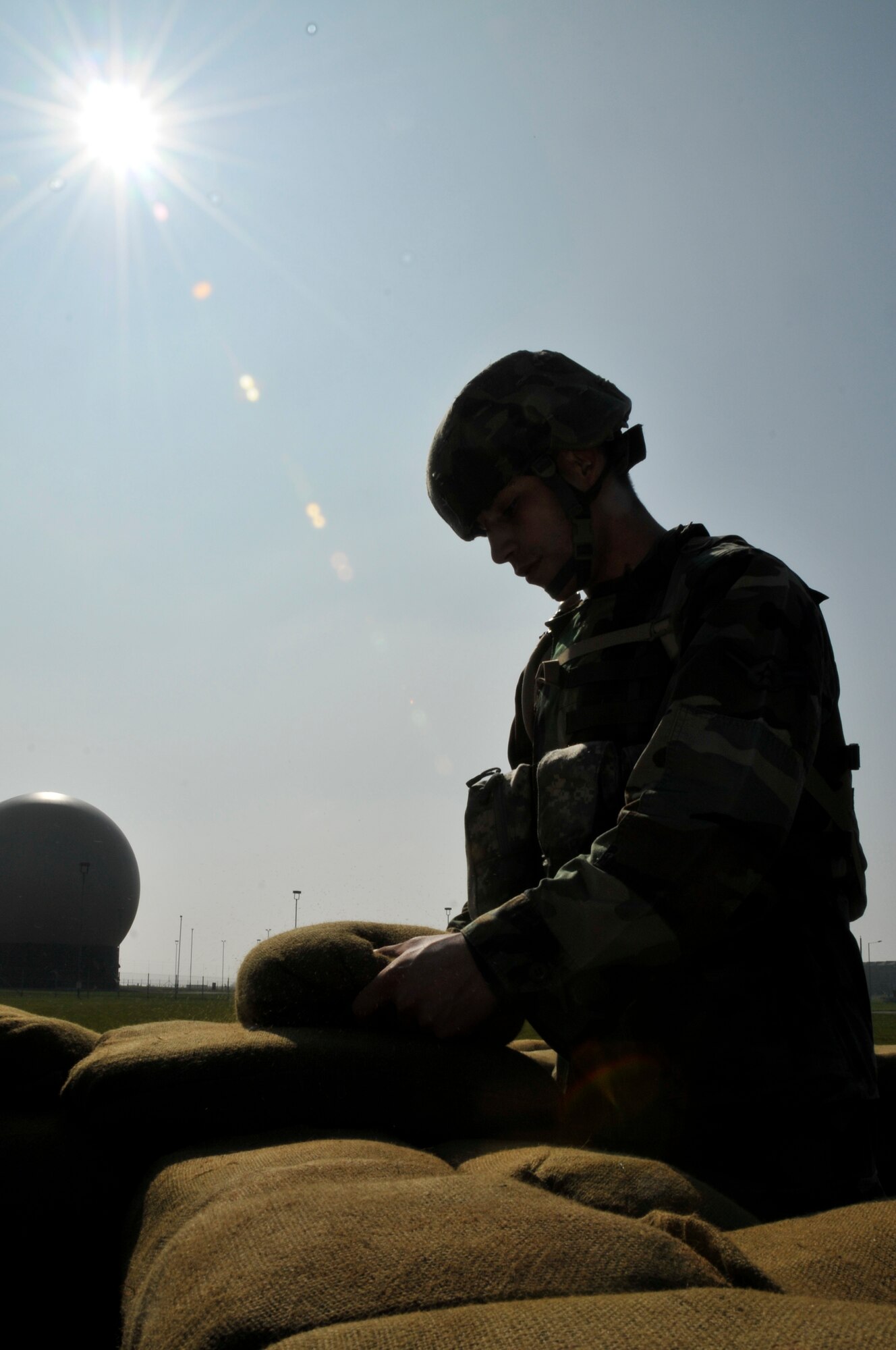 ROYAL AIR FORCE FELTWELL, England -- Airman 1st Class Arturo Rivero, 48th Security Forces Squadron, builds a defensive fighting position here April 2, 2009. Airmen from the 48th SFS built these positions as part of their annual air base defense training. (U.S. Air Force photo by Airman 1st Class Perry Aston) (Released) 
