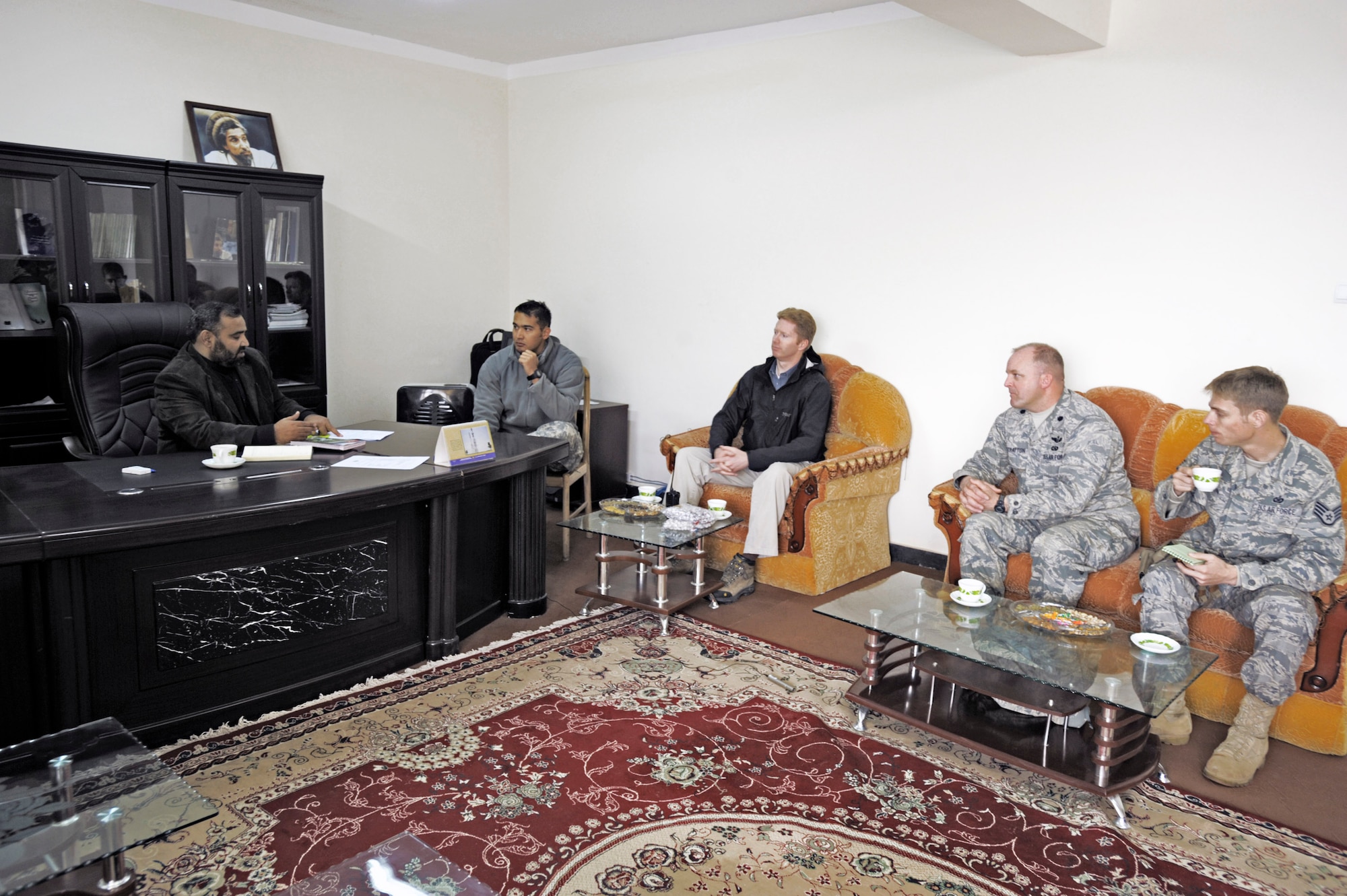 U.S. military and civilian agency members of the Panjshir Provincial Reconstruction Team conduct a meeting with the deputy governor Abdul Kabiri to discuss issues pertaining to the province March 3 in Panjshir, Afghanistan. (U.S. Air Force photo/Staff Sgt. James L. Harper Jr.) 
