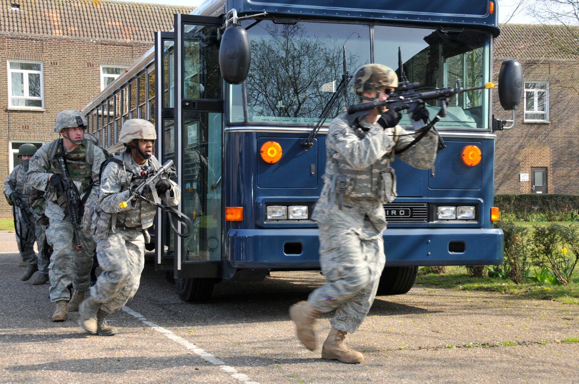 ROYAL AIR FORCE FELTWELL, England -- 48th Security Forces Squadron Airmen prepare to storm a building suspected of being occupied by members of an opposing force here April 2, 2009. Airmen from the 48th SFS participated in an air base defense exercise. The training is an annual requirement for the squadron. (U.S. Air Force photo by Airman 1st Class Perry Aston) (Released)