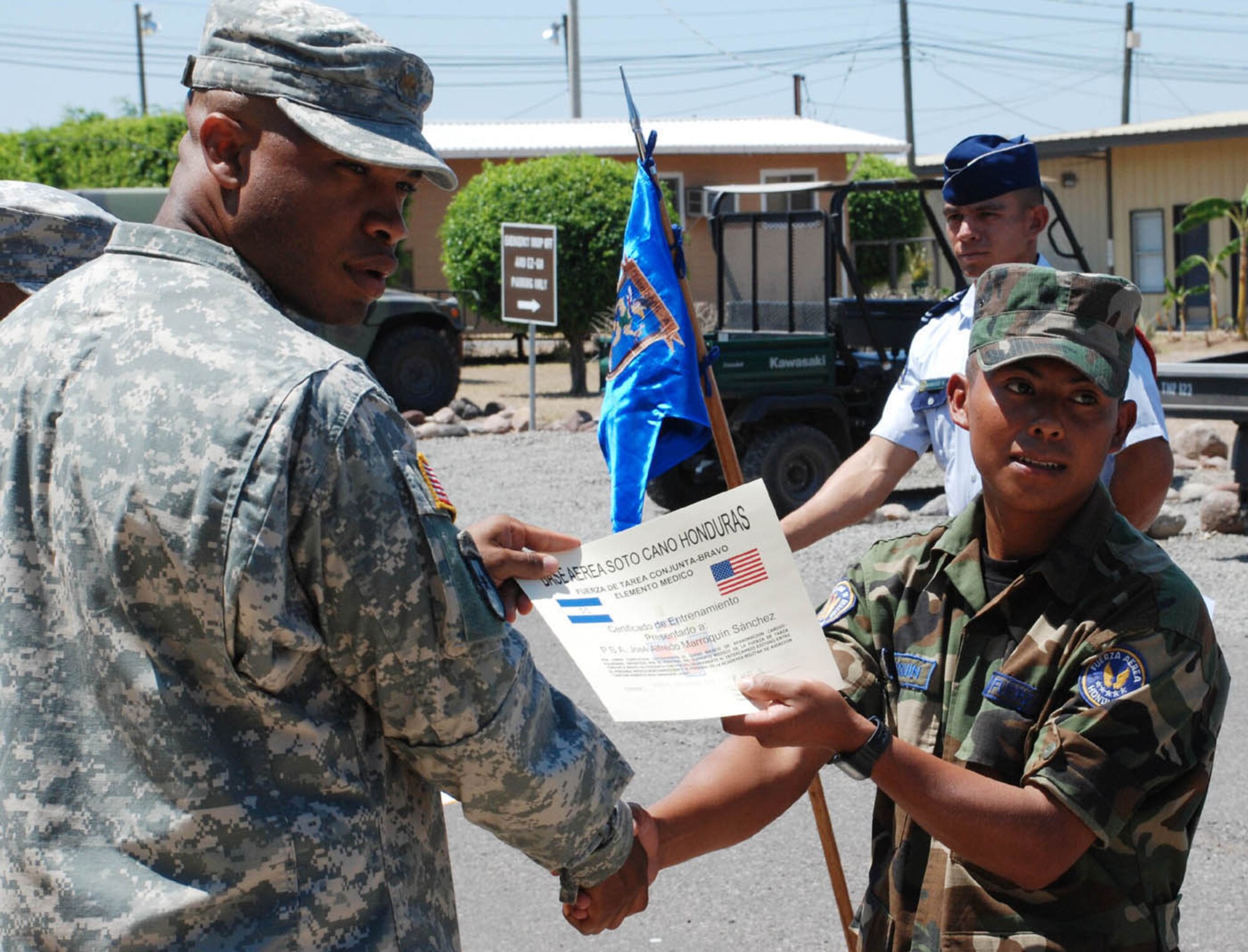 SOTO CANO AIR BASE, Honduras - Maj. Toihunta Stubbs, Joint Task Force-Bravo Medical Element flight surgeon, stops for a picture with Sgt. José Marroquin of the Honduran Air Force, during graduation from JTF-B's combat lifesafer course Friday.  Thirty Honduran Air Force cadets and airmen graduated the course taught by instructors from MEDEL.  During the weeklong course, students learned self-aid and buddy care, how to administer intravenous fluids, and medical evacuation.  (U.S. Air Force photo/Tech. Sgt. Rebecca Danét)