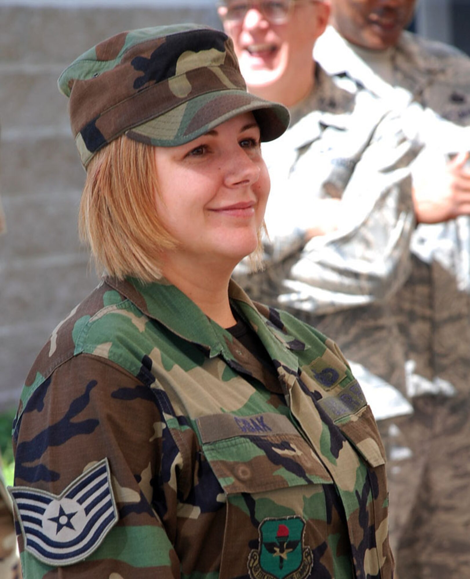 LAUGHLIN AIR FORCE BASE, Texas – Tech. Sgt. Lori Cibak, 47th Comptroller Squadron, smiles after being surprised by Col. John Doucette, 47th Flying Training Wing commander, about her STEP promotion from staff sergeant to technical sergeant here March 24. (U.S. Air Force photo by Airman 1st Class Sara Csurilla)