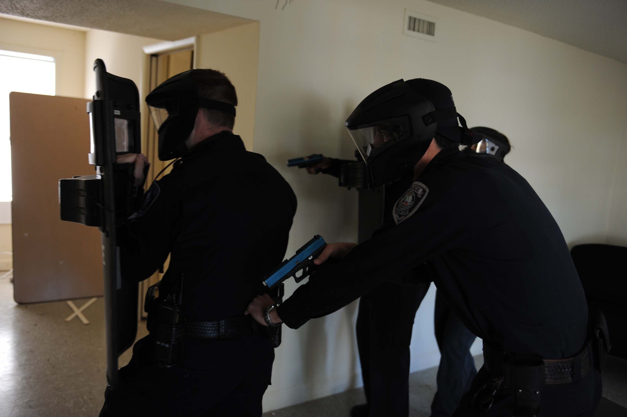 SHAW AIR FORCE BASE, S.C. -- Sumter County police officers approach a simulated hostile during a police training exercise April 4, 2009. The Sumter County Police Department and Shaw Airmen utilized older base housing for police training scenarios. (U.S. Air Force photo/Senior Airman Matt Davis)