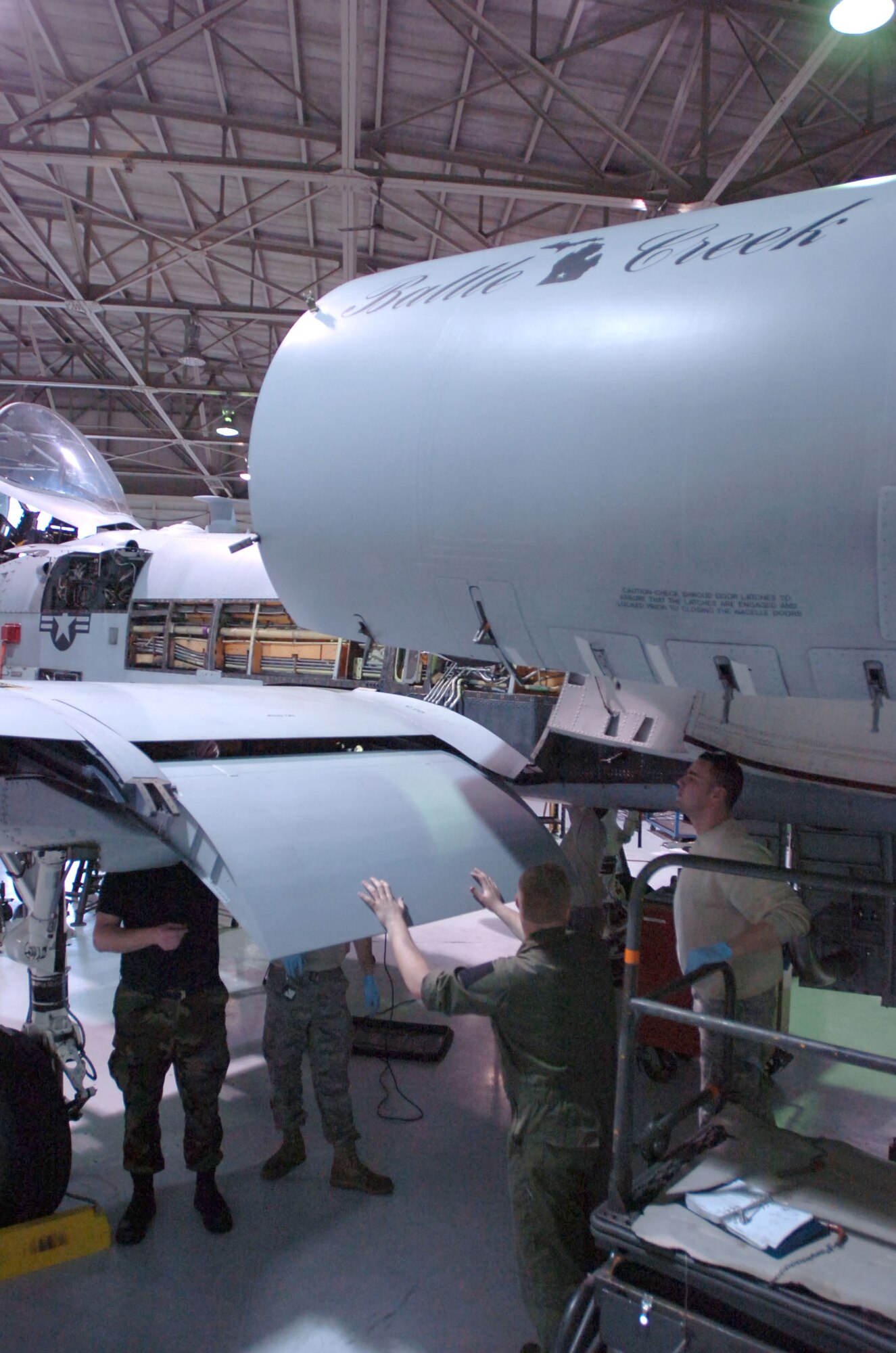 Maintenance Technicians of the 175th Maintenance Group, Maryland National Guard, and 107th Maintenance Group, Michigan National Guard, install a wing flap on an A-10 Thunderbolt close-air-support aircraft at Warfield Air National Guard Base in Essex, Maryland, Friday, April 3, 2009. Michigan Guardmembers in the maintenance field are transitioning from the F-16 fighter jet to the A-10 through on-the-job training. (U.S. Army Photo by Staff Sgt.
S. Patrick McCollum)
