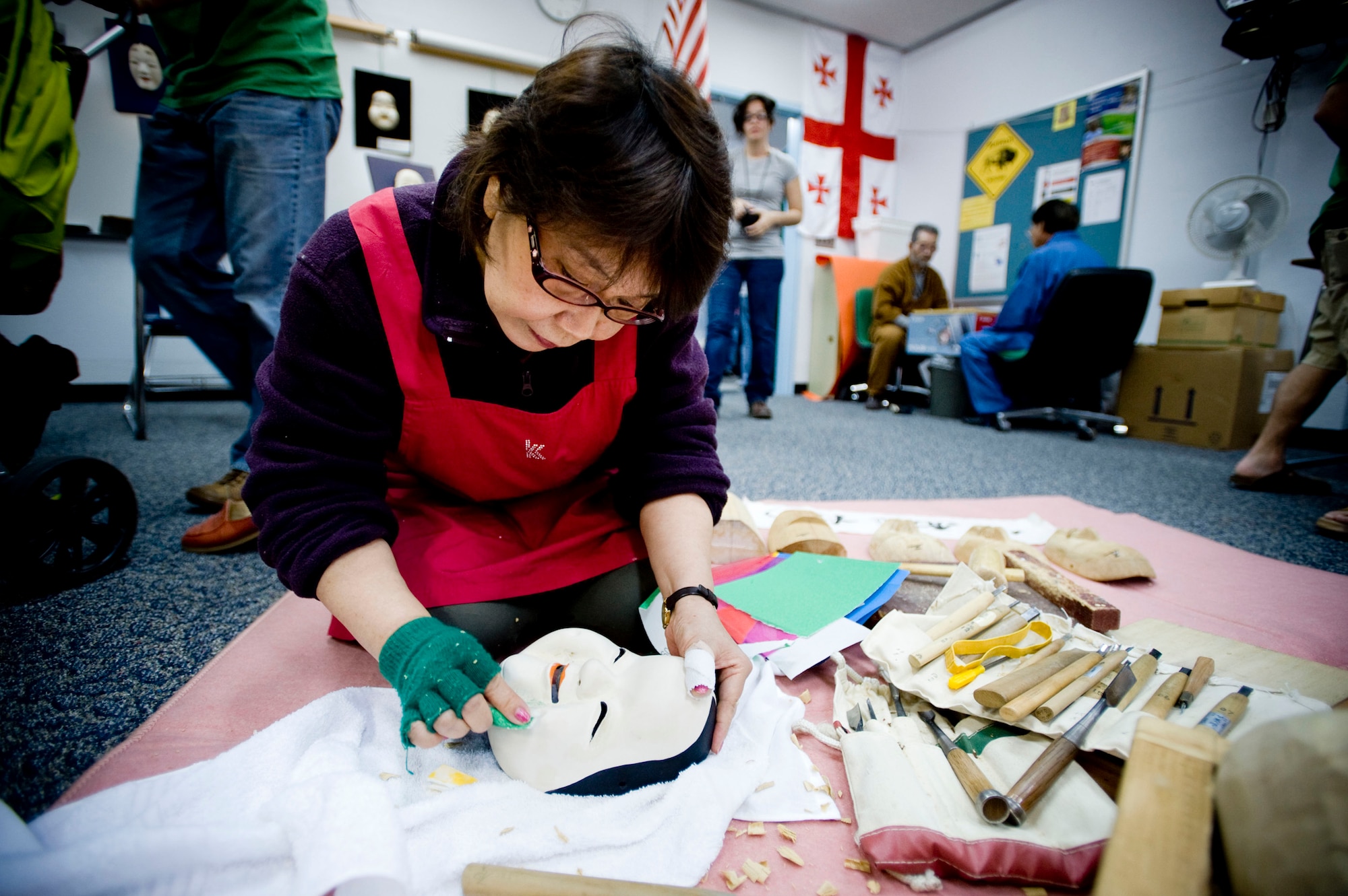 MISAWA AIR BASE, Japan -- Cheiko Ito repairs a noh mask during Japan Day April 4, 2009. Noh theater is a traditional Japanese dramatic theater style. (U.S. Air Force photo by Staff Sgt. Samuel Morse)