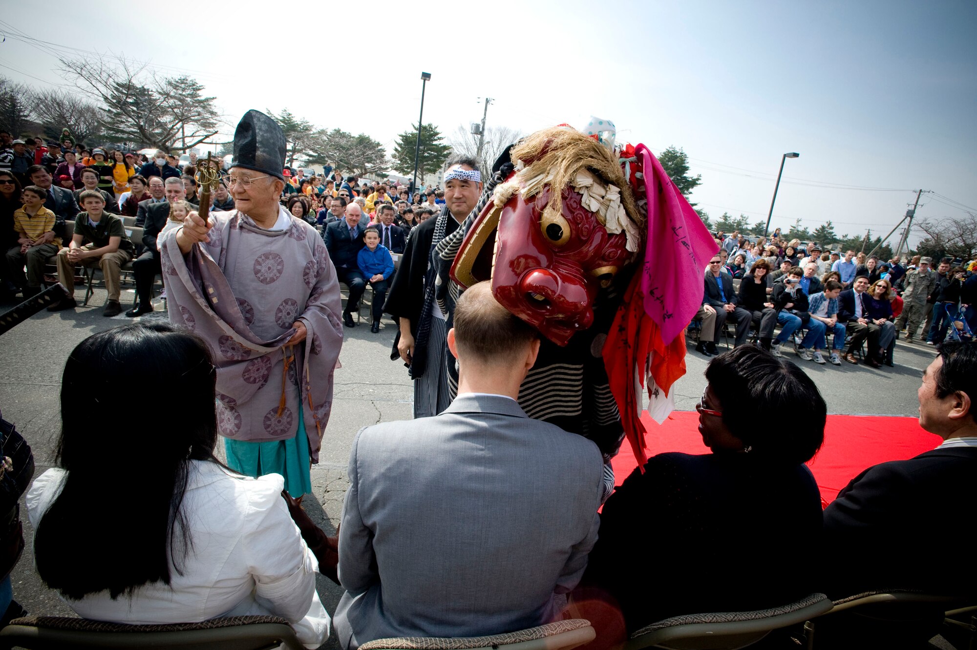 MISAWA AIR BASE, Japan -- A Japanese sacred dragon blesses the distinguished guests during the Japan Day opening ceremony April 4, 2009. The dragon was part of the Kagura Sacred Music and Dancing following the opening remarks of the ceremony. (U.S. Air Force photo by Staff Sgt. Samuel Morse)