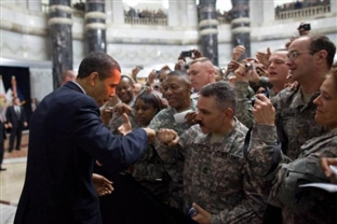 President Barack Obama receives a fist-bump from a U.S. soldier as he greets hundreds of U.S. troops during his April 7, 2009, visit to Camp Victory, Iraq. Obama thanked the troops for their service and personal sacrifice “under enormous strain … through controversy and difficulty and politics.” 
