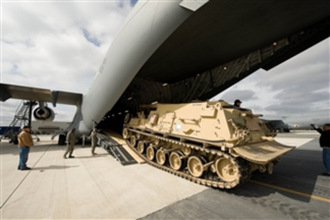 An M88A2 Heavy Equipment Recovery Combat Utility Lift and Evacuation System, also known as Hercules, is loaded into a C-17 Globemaster III aircraft at Dover Air Force Base, Dover, Del., on March 10, 2009.  The Hercules is used to safely tow and recover inoperative tanks.  
