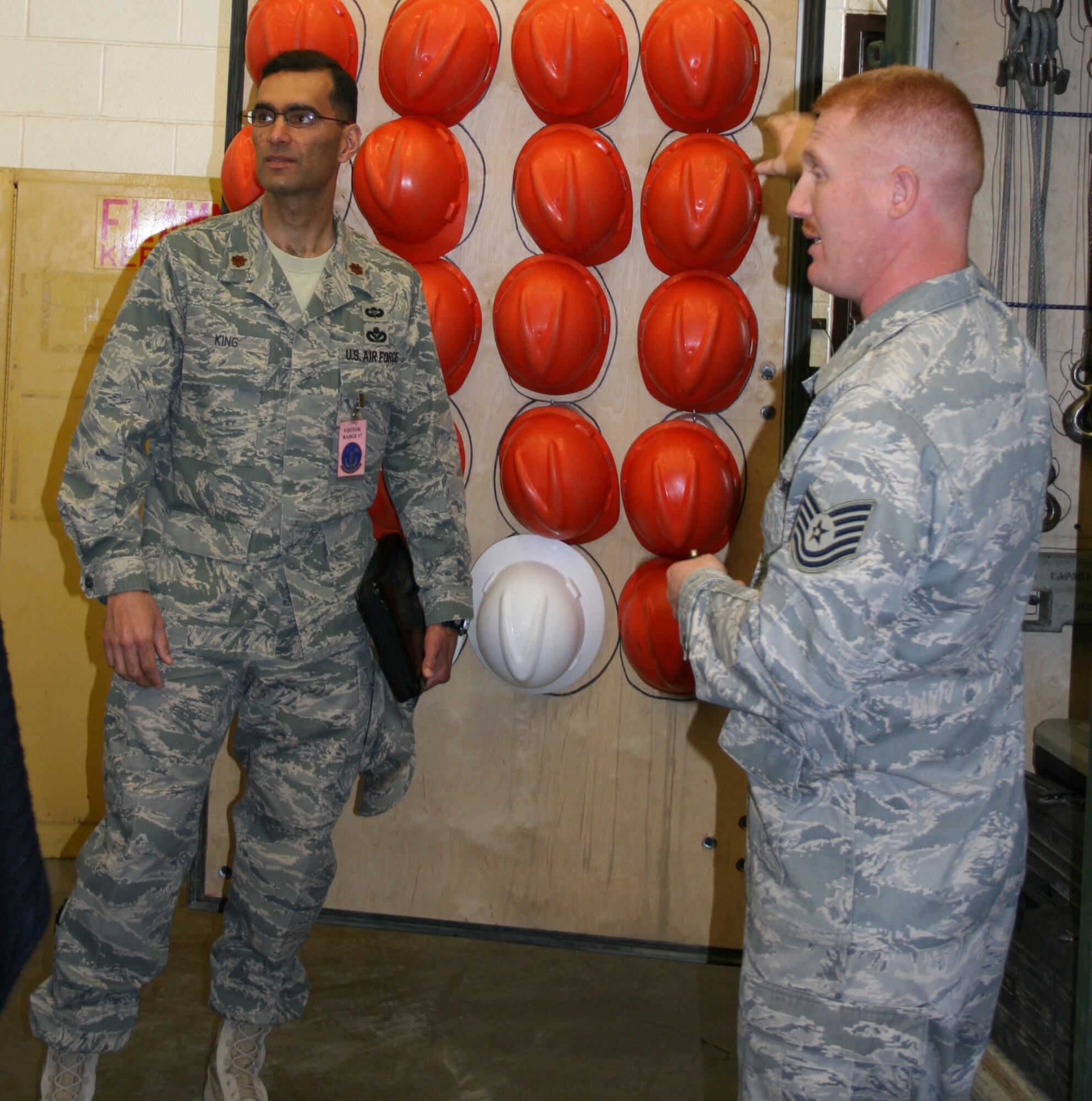 Maj. James King, AFSO-21 facilitator-in-training, and Tech Sgt. Joshua Horton, 9th MUNS, inspect the mobility bins as part of a Rapid Improvement Event. The event was held March 30 thru April 3 as part of the Air Force Smart Operations of the 21 Century to help maximize value and minimize waste. (Courtesy Photo)