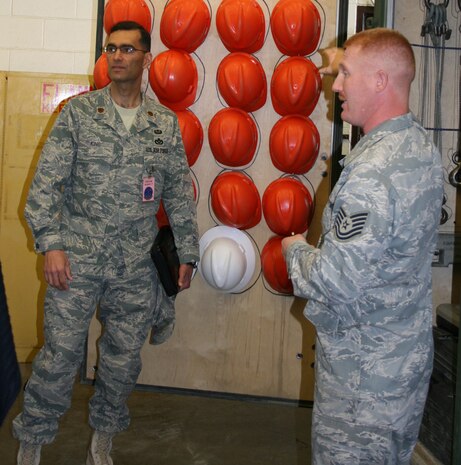 Maj. James King, AFSO-21 facilitator-in-training, and Tech Sgt. Joshua Horton, 9th MUNS, inspect the mobility bins as part of a Rapid Improvement Event. The event was held March 30 thru April 3 as part of the Air Force Smart Operations of the 21 Century to help maximize value and minimize waste. (Courtesy Photo)
