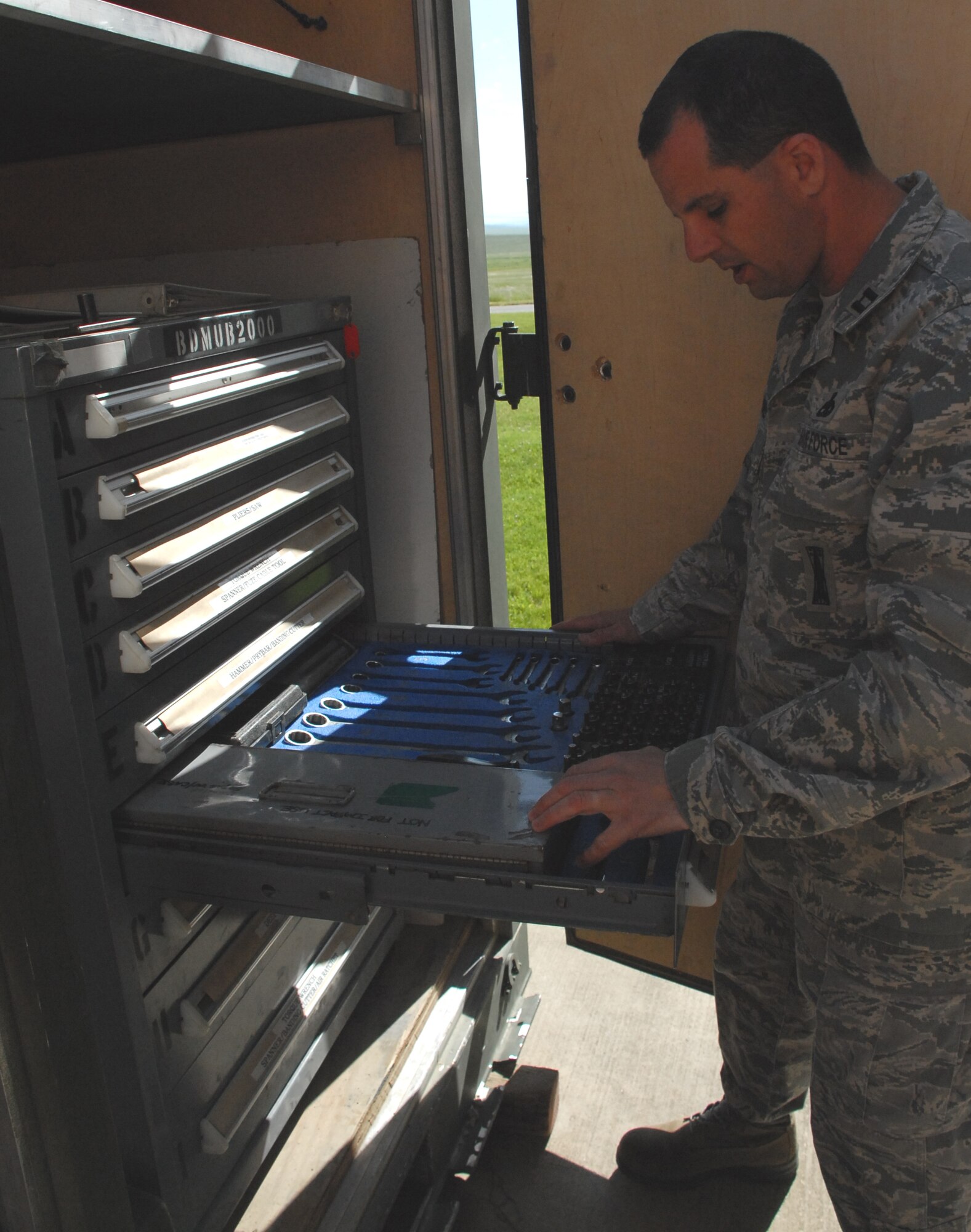 Capt. Mathew Drossner, 9th Munitions Squadron, searches for tools to April 3 during the AFSO-21. The serviceable process was established as part of a Rapid Improvement Event held last week to assist the 9th MUNSin maximizing value and minimizing waste. (Photo by Ashley Cisek)