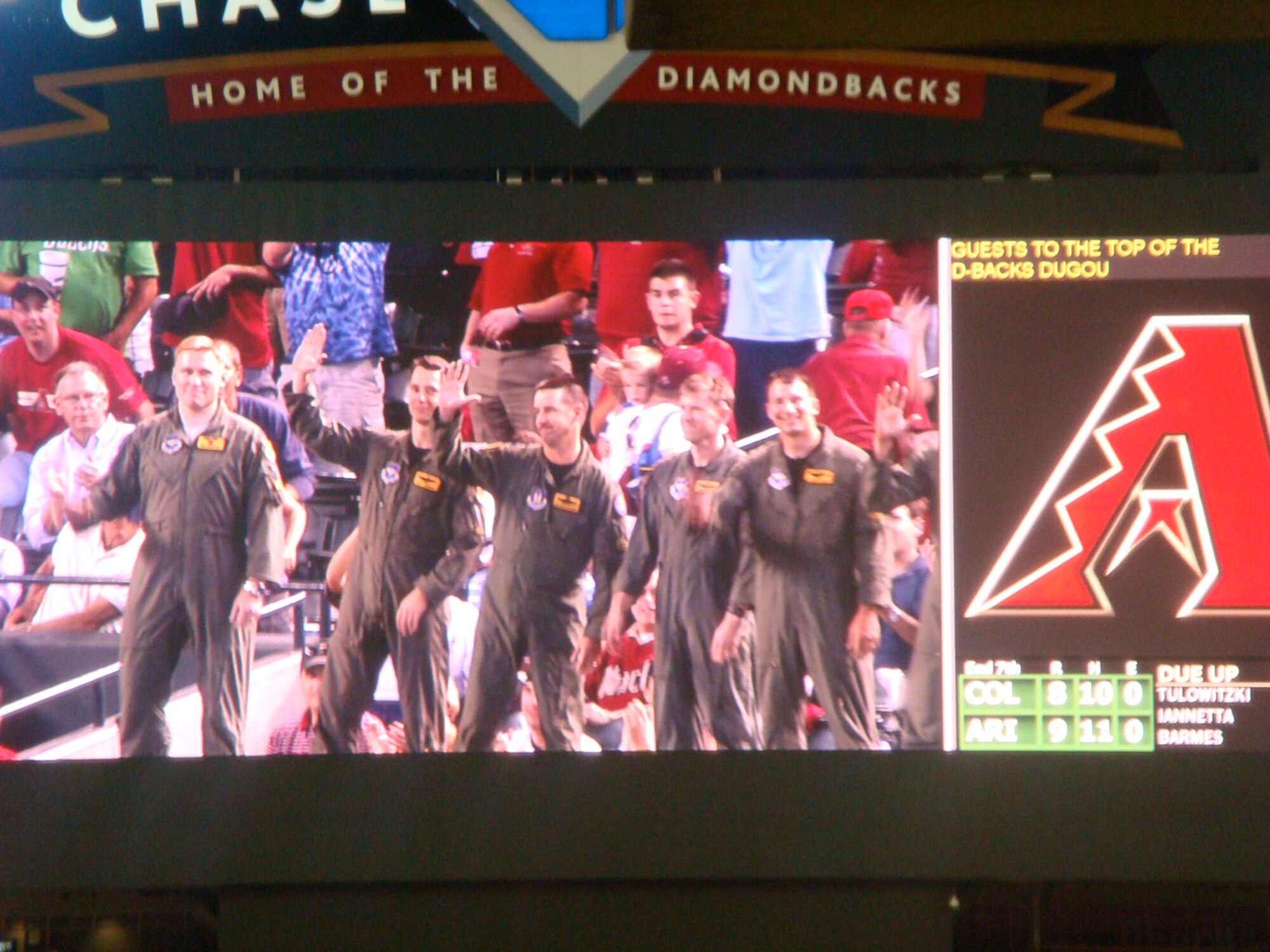 Pilots from the 61st Fighter Squadron, "Top Dogs," are introduced to the crowd in Chase Field and appear on the stadium's jumbotron after conducting a flyover during the Arizona Diamondbacks opening day baseball game April 6 in Phoenix.  (U.S. Air Force photo/Rusty Mitchell)
 
