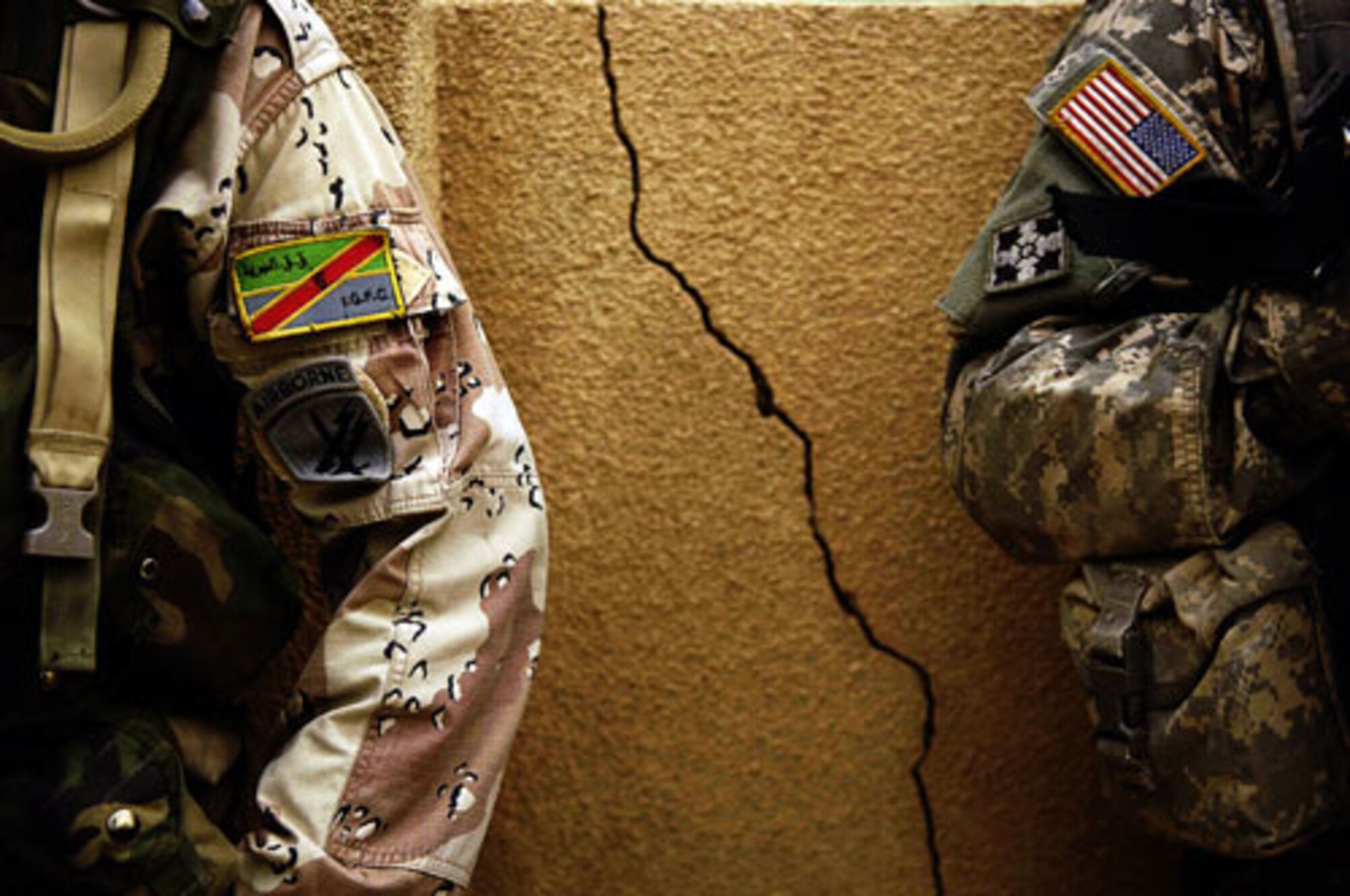 Staff Sgt. Manuel Martinez took first place in the Illustrative Photography category for his photo of a U.S. Army Soldier and a Iraqi Army Solider standing against a wall in Iraq. Sergeant Martinez is with the 1st Combat Camera Squadron. (U.S. Air Force photo/Staff Sgt. Manuel Martinez)