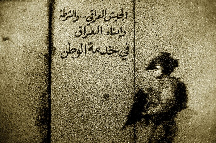 Staff Sgt. Clay Lancaster was awarded first place in the Combat Documentation category of the Visual Information Awards program for his photo of a U.S. Coalition Forces member approaching an entry control point near a village in central Iraq. Sergeant Lancaster is a member of the 1st Combat Camera Squadron. Master Sgt. Andrew Dunaway and Staff Sgt. Aaron Allmon, both from the 1 CTCS, were awarded second and third place in the category. (U.S. Air Force photo/Staff Sgt. Clay Lancaster)