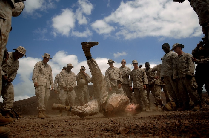 Photos, such as this one of Marine Lance Cpl. Brett Herman from the 3rd Low Altitude Air Defense Battalion, Camp Pendleton, Calif.,  break dancing in Djibouti helped Technical Sgt. Jeremy Lock, 1st Combat Camera Squadron, win the Military Photographer of the Year award for the fourth time in his career. Master Sgt. Andrew Dunaway and Staff Sgt. Manuel Martinez, both from 1 CTCS,  were the first and second runners up in the Photographer of the Year category. (U.S. Air Force photo/ Tech. Sgt. Jeremy Lock)