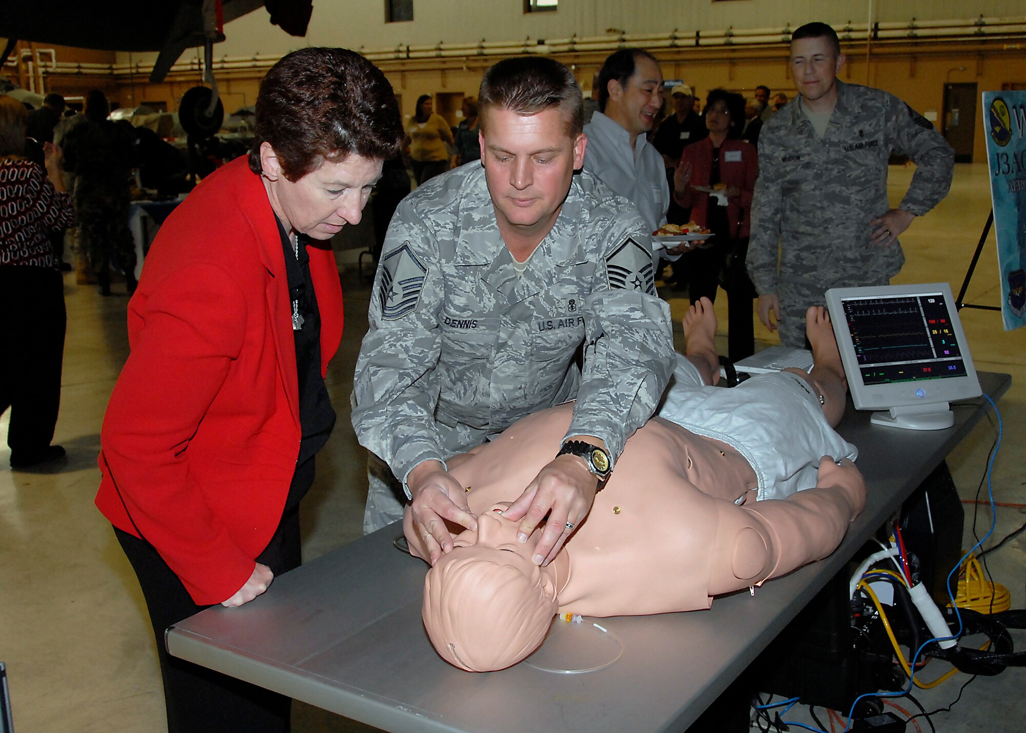 Master Sgt. Dan Dennis, 383rd Training Squadron, demonstrates the capabilities of SimMan, a computerized patient for training, to Dr. Angela Canada, 882nd Training Group director of education, at the 82nd Medical Group Provider Open House. The open house provided an opportunity for Sheppard's civilian medical counterparts to understand Sheppard's mission and network. (U.S. Air Force photo/Mike Litteken)
