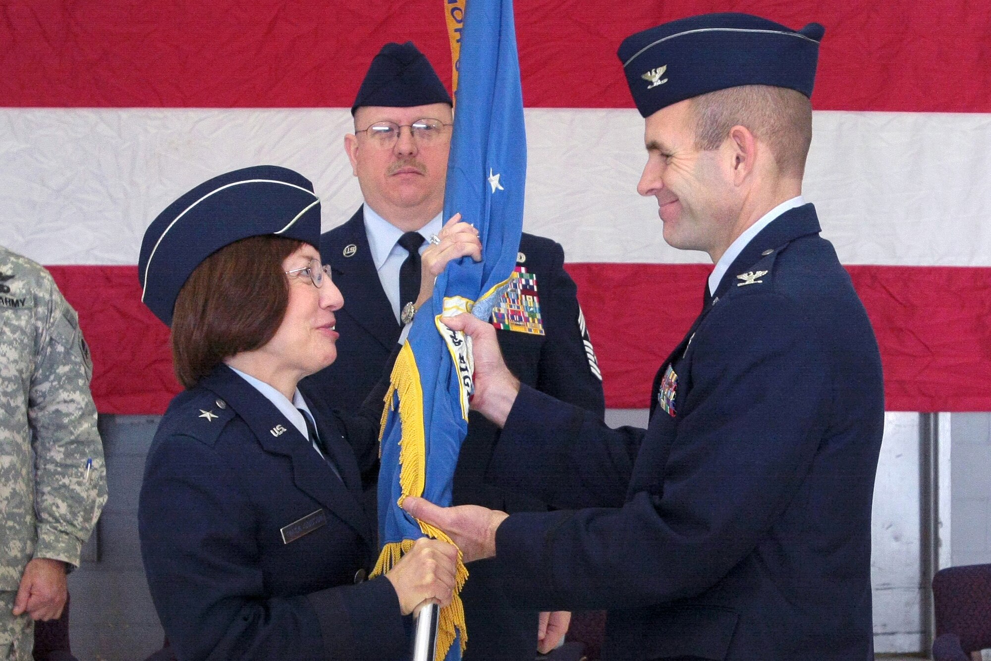 A picture of Col. Robert C. Bolton, incoming 177th Fighter Wing commander, accepting the 177th’s Colors from Brig. Gen. Maria Falca-Dodson New Jersey Air National Guard commander.