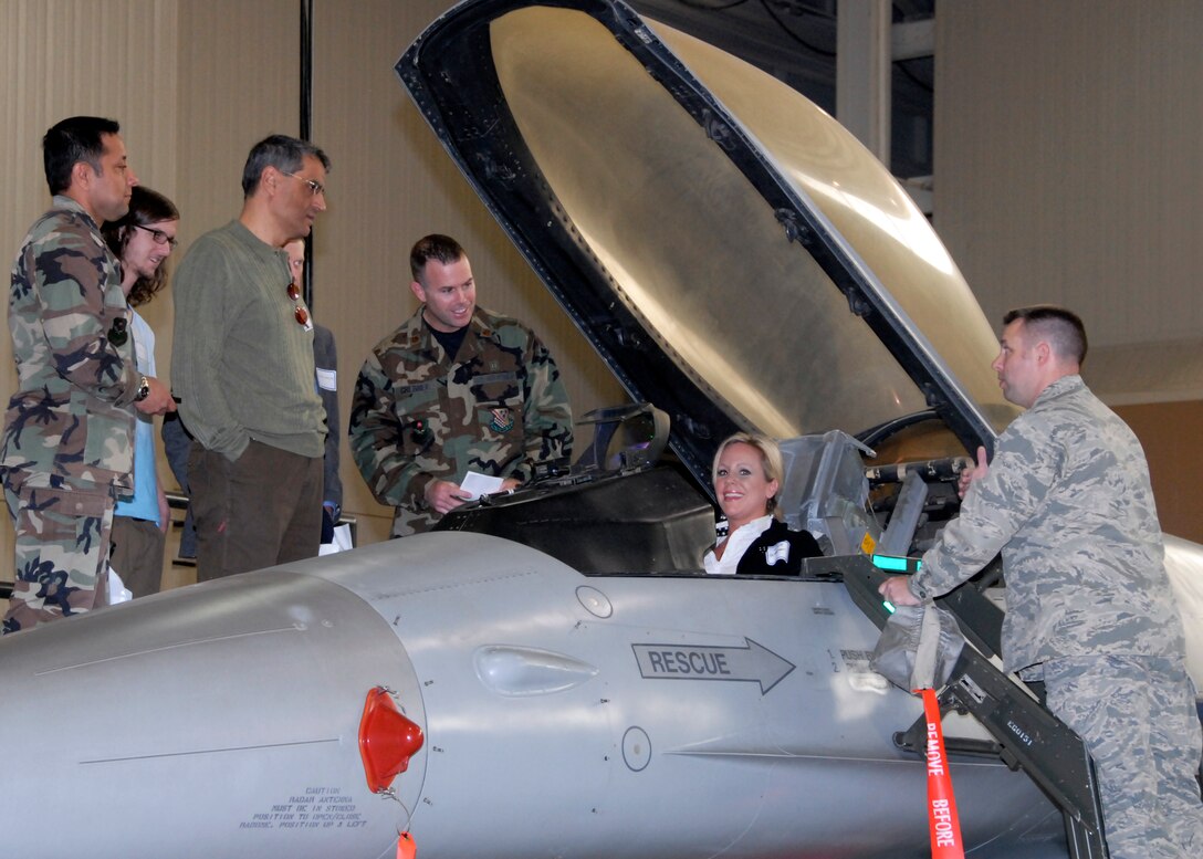Capt. Michael Spaulding, director of operations in the 363rd Training Squadron, shows Marcie Grebner, a United Regional representative, the controls in the trainer cockpit at the 82nd Medical Group Provider Open House. The open house provided an opportunity for Sheppard's medical civiliancounterparts to understand Sheppard's mission and network. (U.S. Air Force photo/Mike Litteken)
